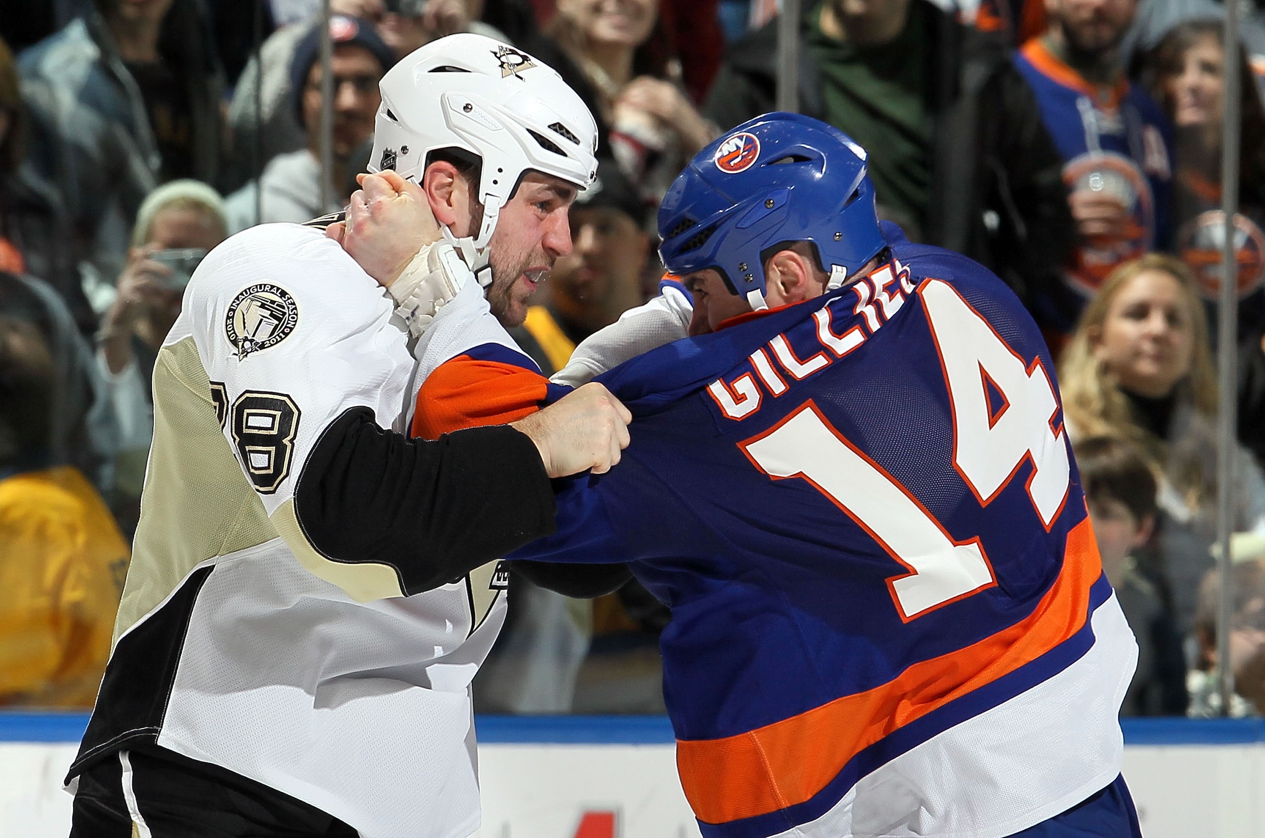 UNIONDALE, NY - FEBRUARY 11: Trevor Gillies #14 of the New York Islanders battles Eric Godard #28 of the Pittsburgh Penguins during their first period fight on February 11, 2011 at Nassau Coliseum in Uniondale, New York.  (Photo by Jim McIsaac/Getty Image