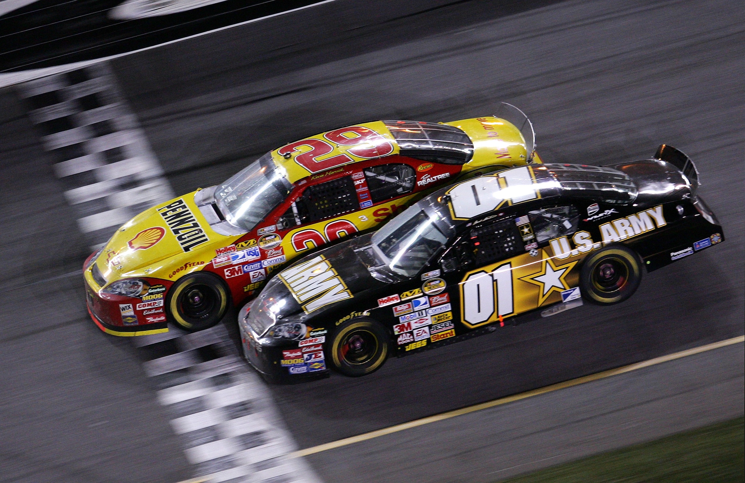 DAYTONA, FL - FEBRUARY 18: Kevin Harvick, driver of the #29 Shell/Pennzoil Chevrolet, leads Mark Martin, driver of the #01 U.S. ARMY Chevrolet, to the finish line to win the NASCAR Nextel Cup Series Daytona 500 at Daytona International Speedway on Februa DAYTONA, FL - FEBRUARY 18: Kevin Harvick, driver of the #29 Shell/Pennzoil Chevrolet, leads Mark Martin, driver of the #01 U.S. ARMY Chevrolet, to the finish line to win the NASCAR Nextel Cup Series Daytona 500 at Daytona International Speedway on Februa
