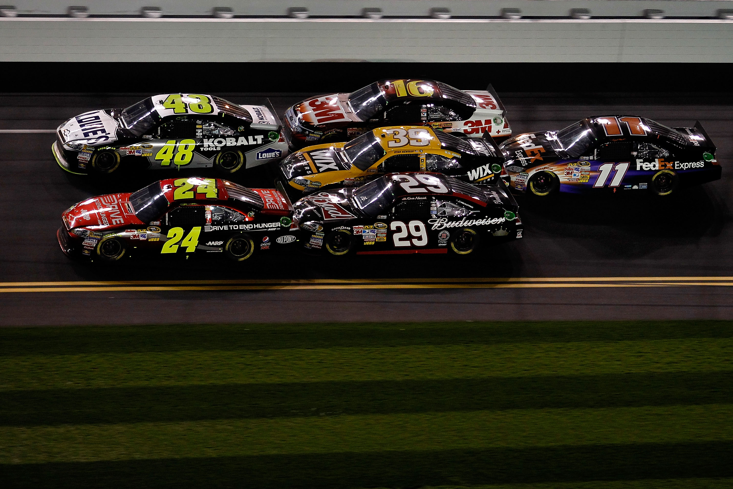 DAYTONA BEACH, FL - FEBRUARY 12:  Jeff Gordon, driver of the #24 Drive to End Hunger Chevrolet, and Jimmie Johnson, driver of the #48 Lowe's Chevrolet, lead Kevin Harvick, driver of the #29 Budweiser Chevrolet, Ryan Newman, driver of the #39 Wix Chevrolet