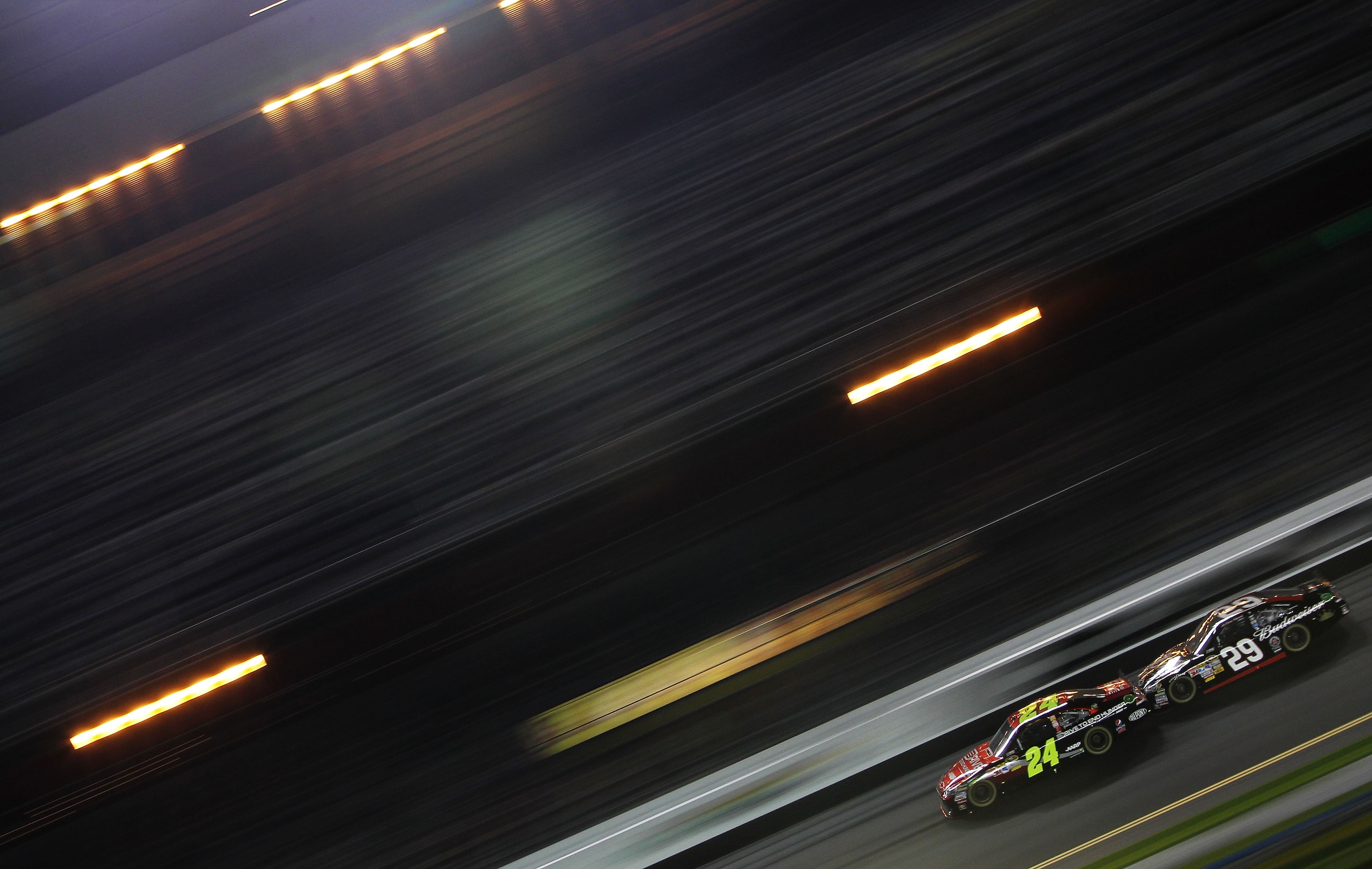 DAYTONA BEACH, FL - FEBRUARY 12: Kevin Harvick, driver of the #29 Budweiser Chevrolet, leads Jeff Gordon, driver of the #24 Drive to End Hunger Chevrolet, during the NASCAR Budweiser Shootout at Daytona International Speedway on February 12, 2011 in Dayt DAYTONA BEACH, FL - FEBRUARY 12: Kevin Harvick, driver of the #29 Budweiser Chevrolet, leads Jeff Gordon, driver of the #24 Drive to End Hunger Chevrolet, during the NASCAR Budweiser Shootout at Daytona International Speedway on February 12, 2011 in Dayt