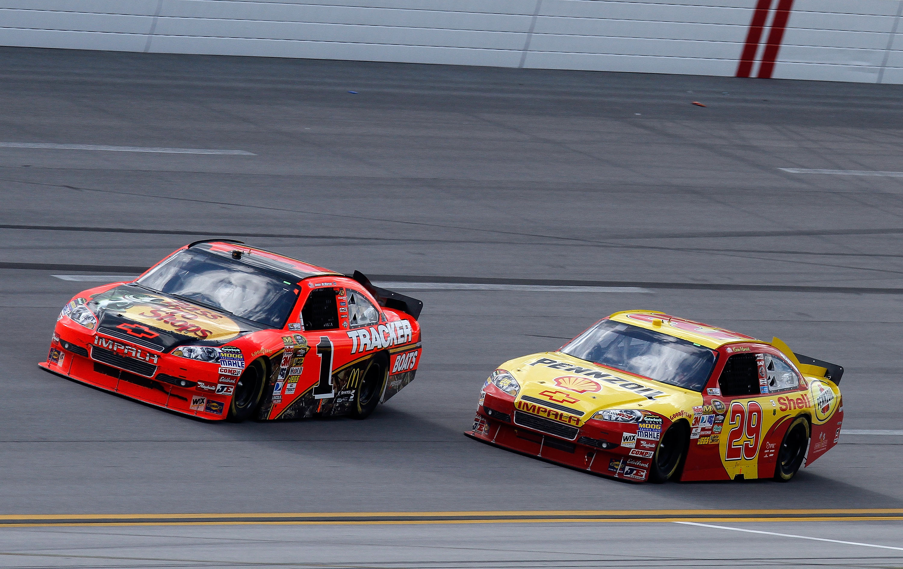 TALLADEGA, AL - APRIL 25:  Kevin Harvick, driver of the #29 Shell/Pennzoil Chevrolet, races Jamie McMurray, driver of the #1 Bass Pro Shops Chevrolet, to the finish of the NASCAR Sprint Cup Series Aaron's 499 at Talladega Superspeedway on April 25, 2010 i