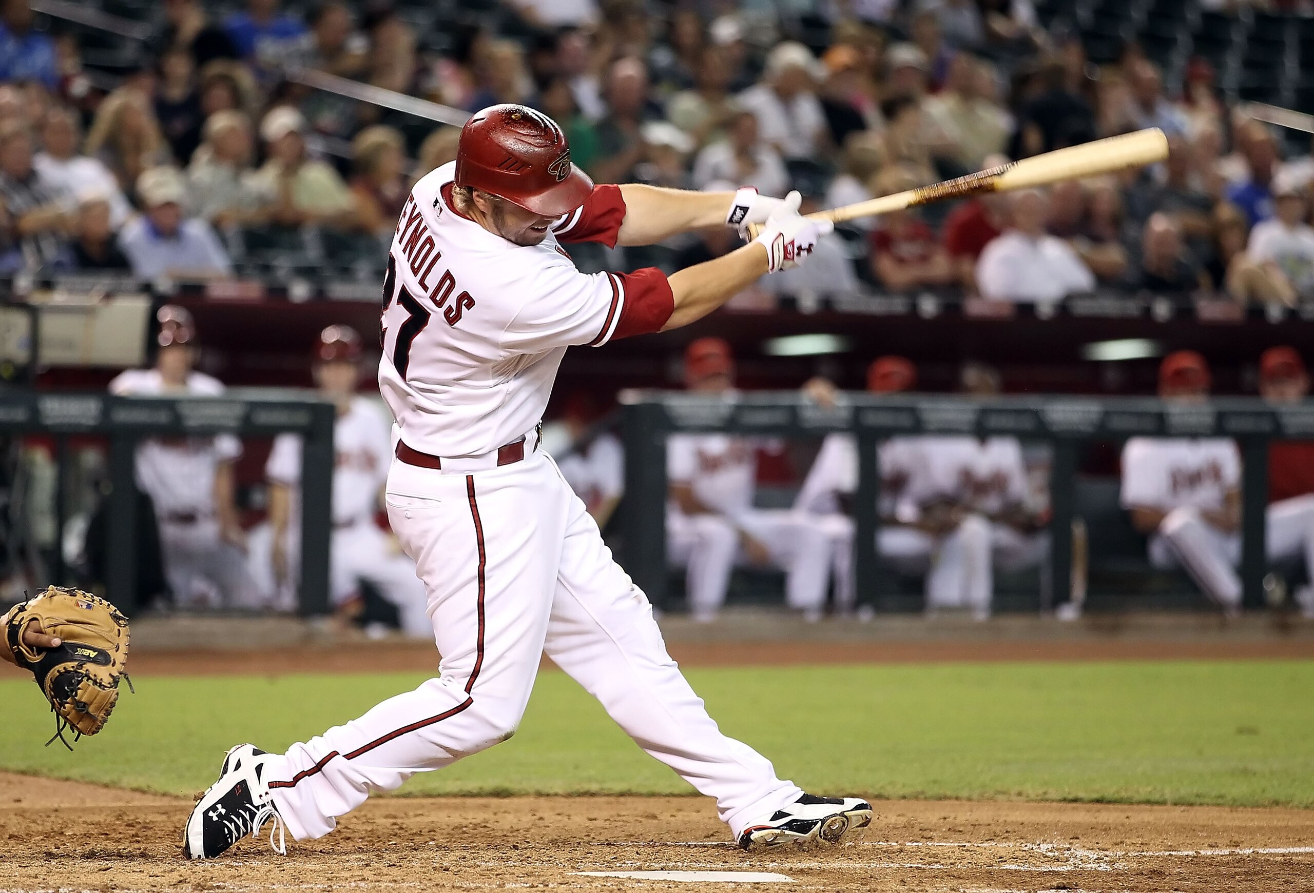 PHOENIX - AUGUST 30:  Mark Reynolds #27 of the Arizona Diamondbacks hits a 2 run home run against the San Diego Padres during the third inning of the Major League Baseball game at Chase Field on August 30, 2010 in Phoenix, Arizona.  (Photo by Christian Pe