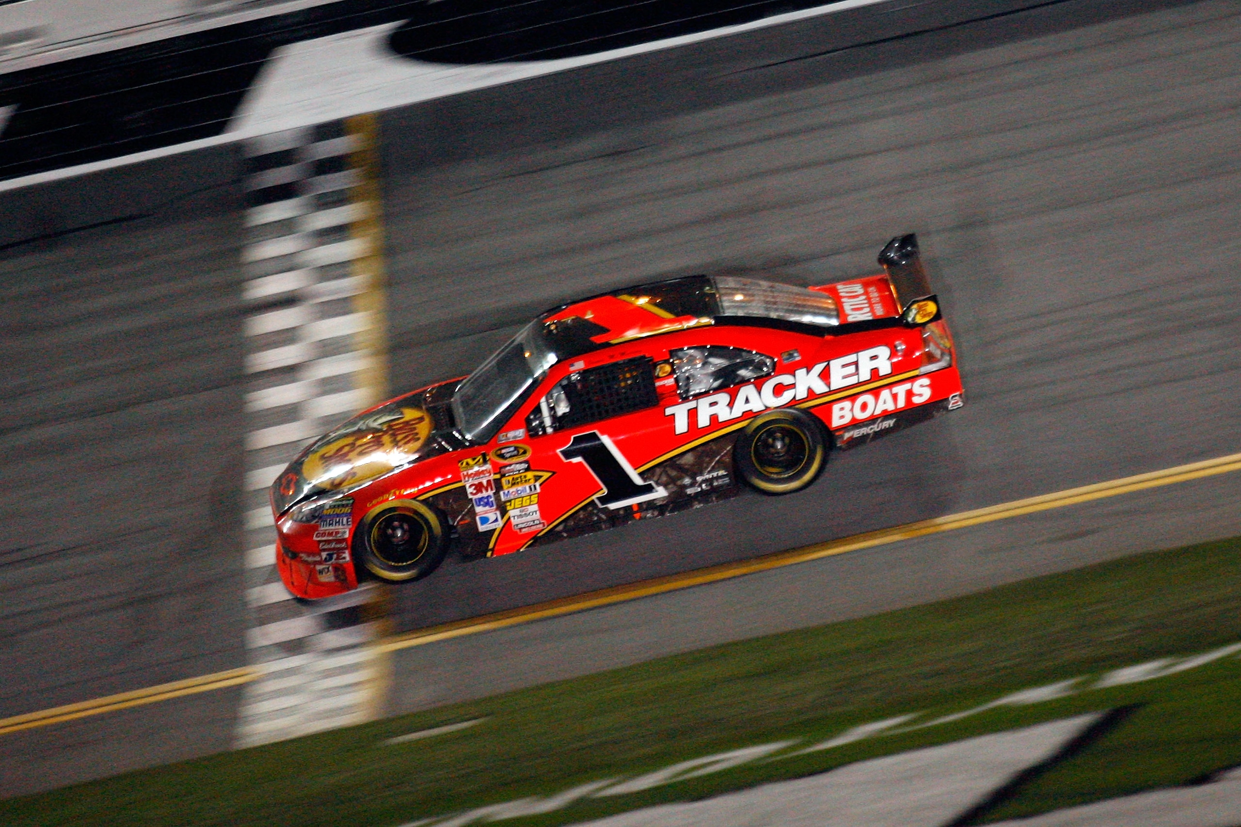 DAYTONA BEACH, FL - FEBRUARY 14:  Jamie McMurray, driver of the #1 Bass Pro Shops/Tracker Boats Chevrolet, crosses the finish line to win the the NASCAR Sprint Cup Series Daytona 500 at Daytona International Speedway on February 14, 2010 in Daytona Beach,