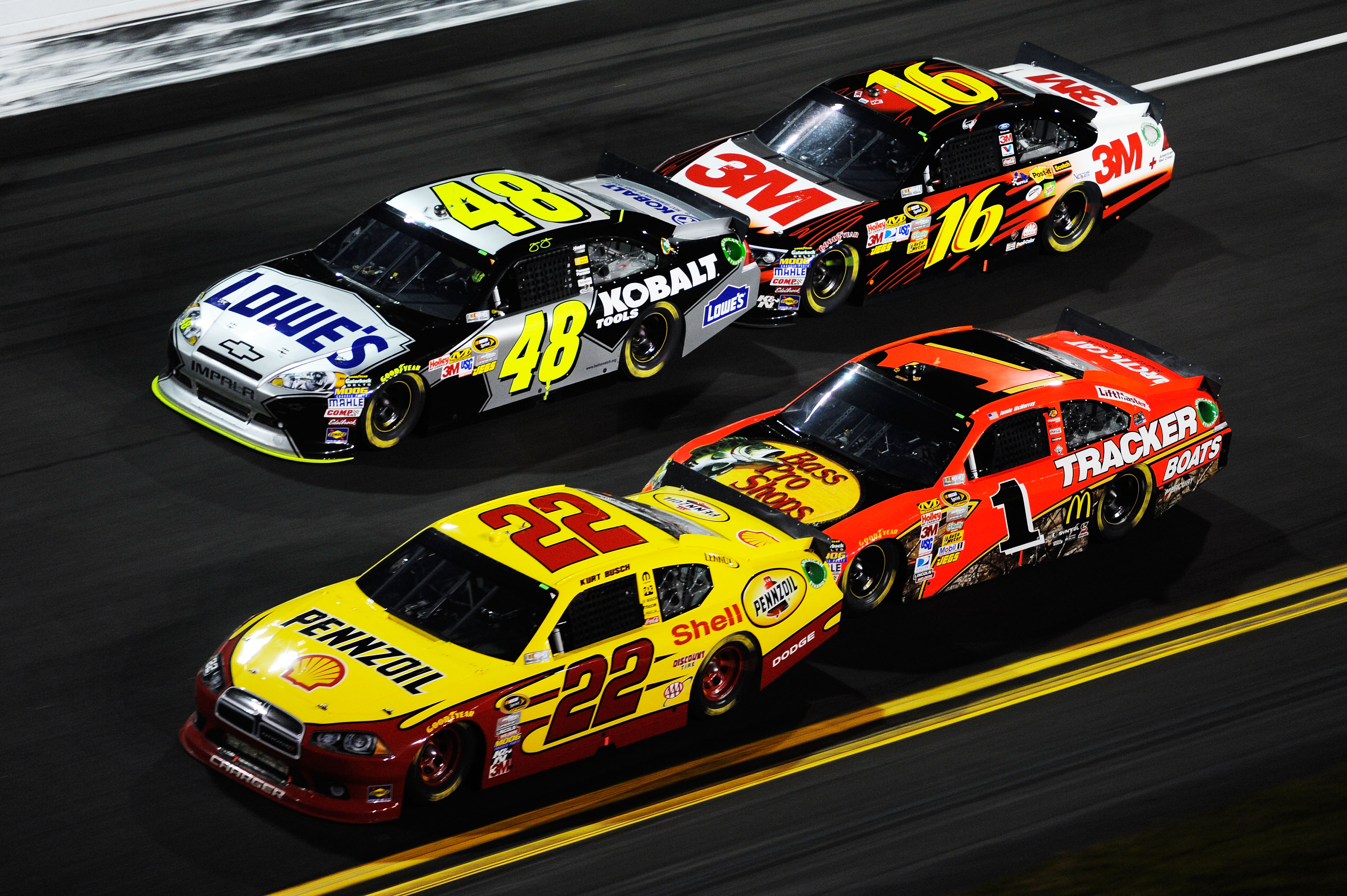 DAYTONA BEACH, FL - FEBRUARY 12:  Kurt Busch, driver of the #22 Shell/Pennzoil Dodge, Jimmie Johnson, driver of the #48 Lowe's Chevrolet, Jamie McMurray, driver of the #1 Bass Pro Shops Chevrolet, and Greg Biffle, driver of the #16 3M Ford, race during th