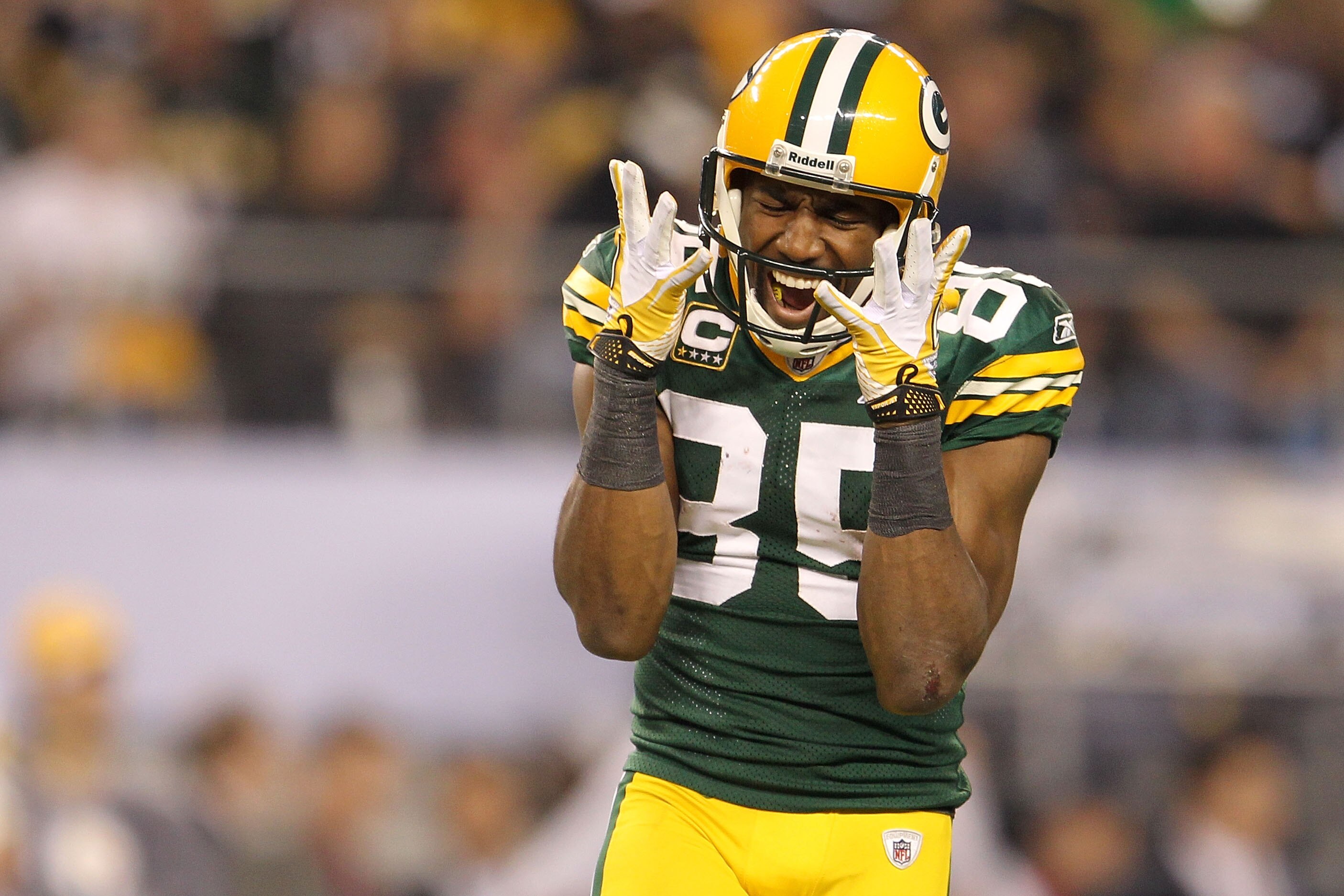 ARLINGTON, TX - FEBRUARY 06:  Greg Jennings #85 of the Green Bay Packers celebrates after a first down catch in the fourth quarter during Super Bowl XLV at Cowboys Stadium on February 6, 2011 in Arlington, Texas.  (Photo by Jamie Squire/Getty Images)