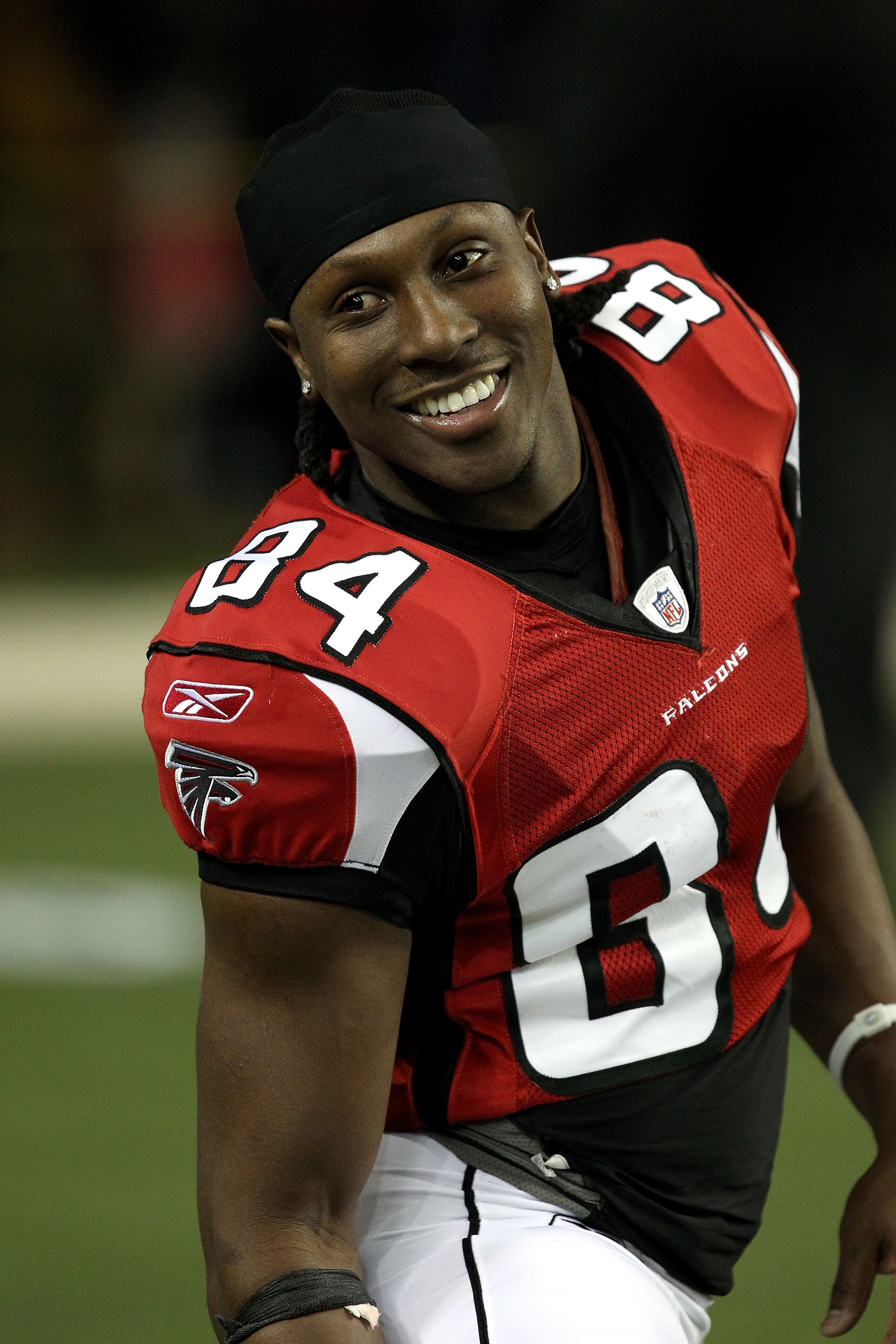 ATLANTA, GA - JANUARY 15:  Roddy White #84 of the Atlanta Falcons smiles during warm ups against the Green Bay Packers during their 2011 NFC divisional playoff game at Georgia Dome on January 15, 2011 in Atlanta, Georgia.  (Photo by Streeter Lecka/Getty I