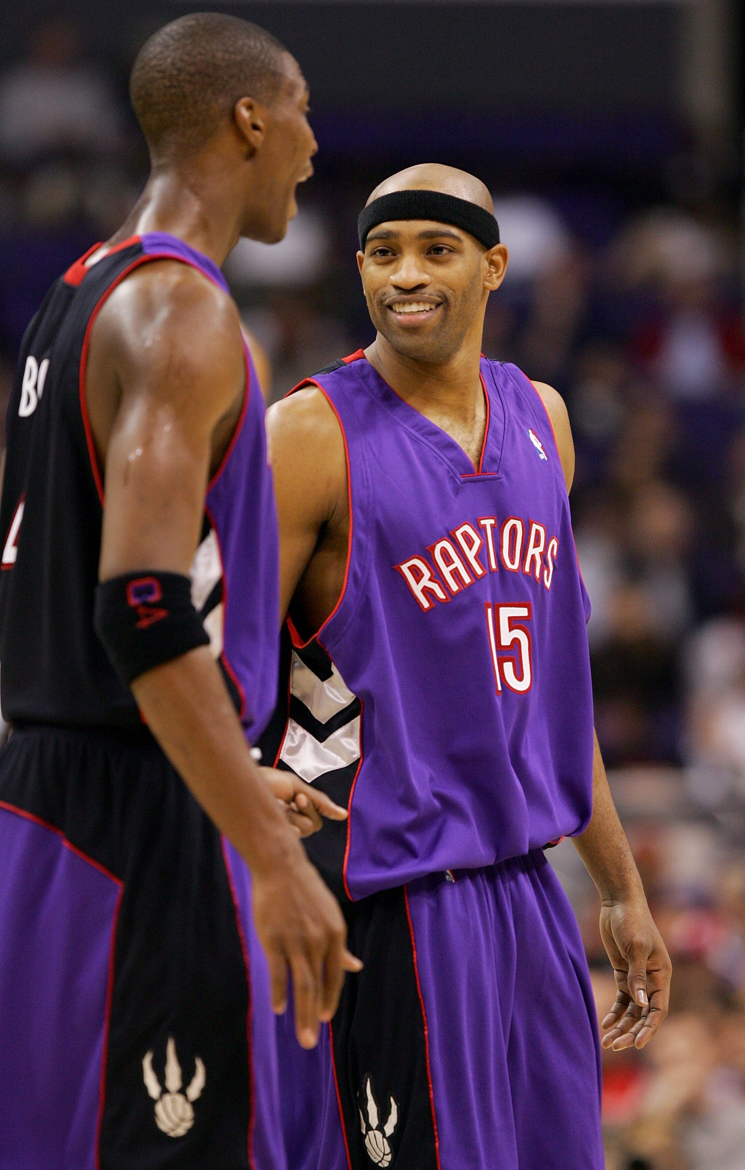 LOS ANGELES - NOVEMBER 16:  Chris Bosh #4 and Vince Carter #15 of the Toronto Raptors talk during the game the Los Angeles Clippers at Staples Center on November 16, 2004 in Los Angeles, California.  NOTE TO USER: User expressly acknowledges and agrees th