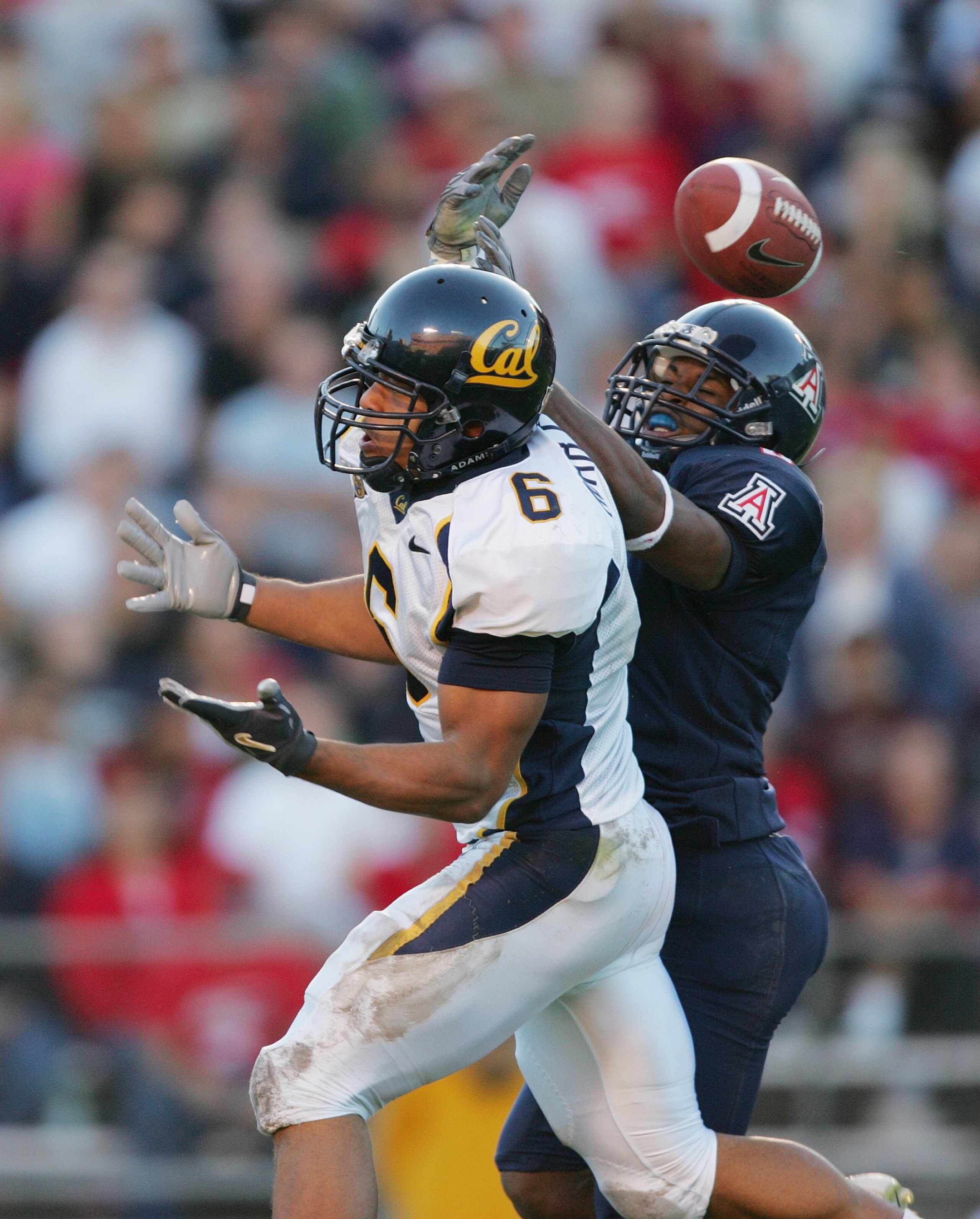 TUCSON, AZ - OCTOBER 23:   Wide receiver Geoff McArthur #6 of California tries to catch the ball against Arizona at Arizona Stadium on October 23, 2004 in Tucson, Arizona.  Cal defeated Arizona 38-0. (Photo by Harry How/Getty Images)