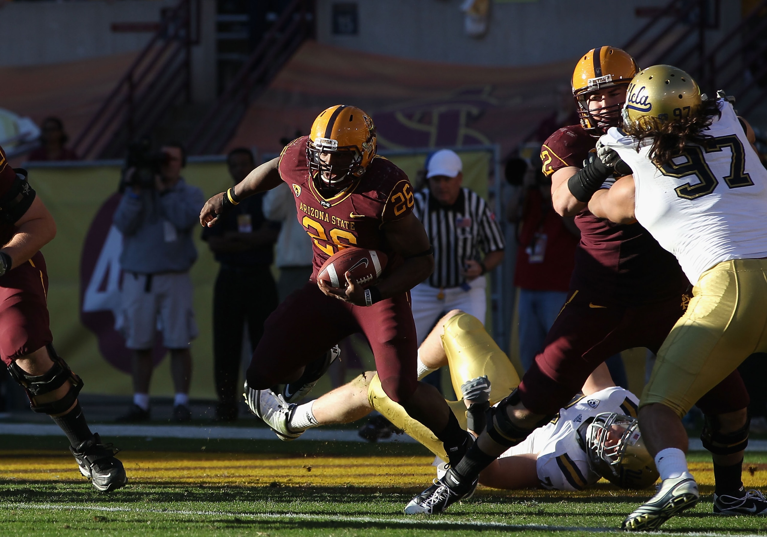 TEMPE, AZ - NOVEMBER 26:  Runningback Cameron Marshall #26 of the Arizona State Sun Devils rushes the football agianst the UCLA Bruins during the college football game at Sun Devil Stadium on November 26, 2010 in Tempe, Arizona.   The Sun Devils defeated