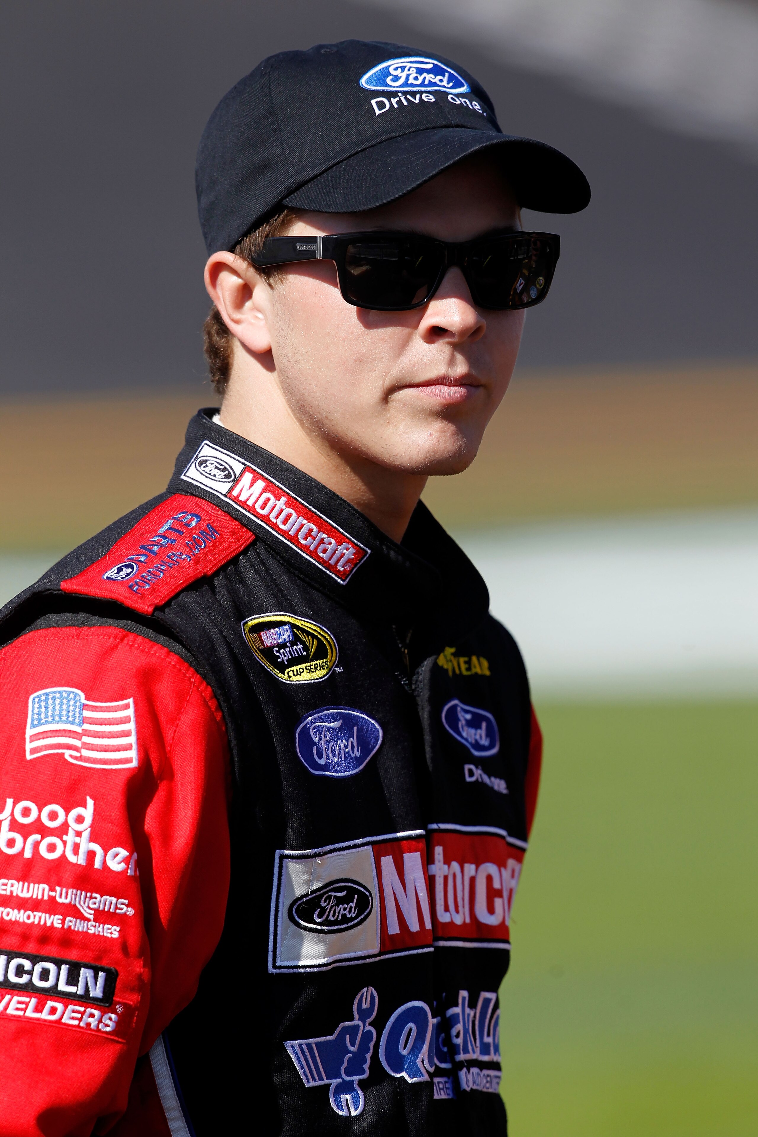 DAYTONA BEACH, FL - FEBRUARY 13:  Trevor Bayne, driver of the #21 Motorcraft/Quick Lane Ford, looks on during qualifying for the NASCAR Sprint Cup Series Daytona 500 at Daytona International Speedway on February 13, 2011 in Daytona Beach, Florida.  (Photo