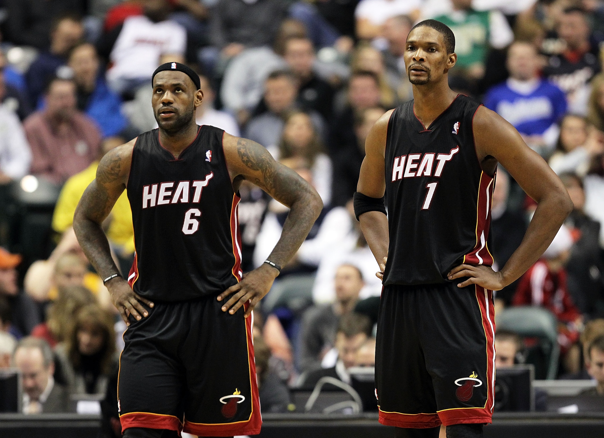 INDIANAPOLIS - FEBRUARY 15: LeBron James #6 and Chris Bosh #1 of the Miami Heat watch play during the NBA game against the Indiana Pacers at Conseco Fieldhouse on February 15, 2011 in Indianapolis, Indiana. The Heat won 110-103. NOTE TO USER: User ex INDIANAPOLIS - FEBRUARY 15: LeBron James #6 and Chris Bosh #1 of the Miami Heat watch play during the NBA game against the Indiana Pacers at Conseco Fieldhouse on February 15, 2011 in Indianapolis, Indiana. The Heat won 110-103. NOTE TO USER: User ex