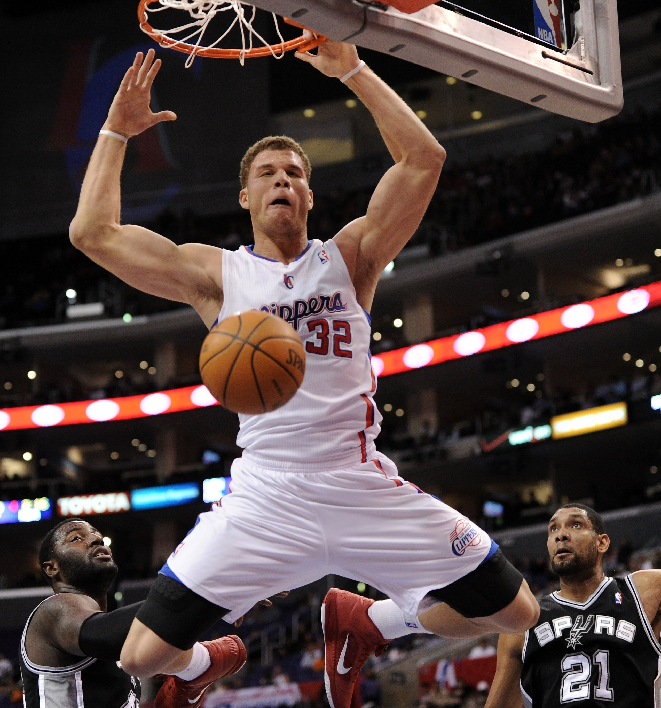 LOS ANGELES, CA - DECEMBER 01:  Blake Griffin #32 of the Los Angeles Clippers reacts to his dunk in front of DeJuan Blair #45 and Tim Duncan #21 of the San Antonio Spurs at the Staples Center on December 1, 2010 in Los Angeles, California.  NOTE TO USER: