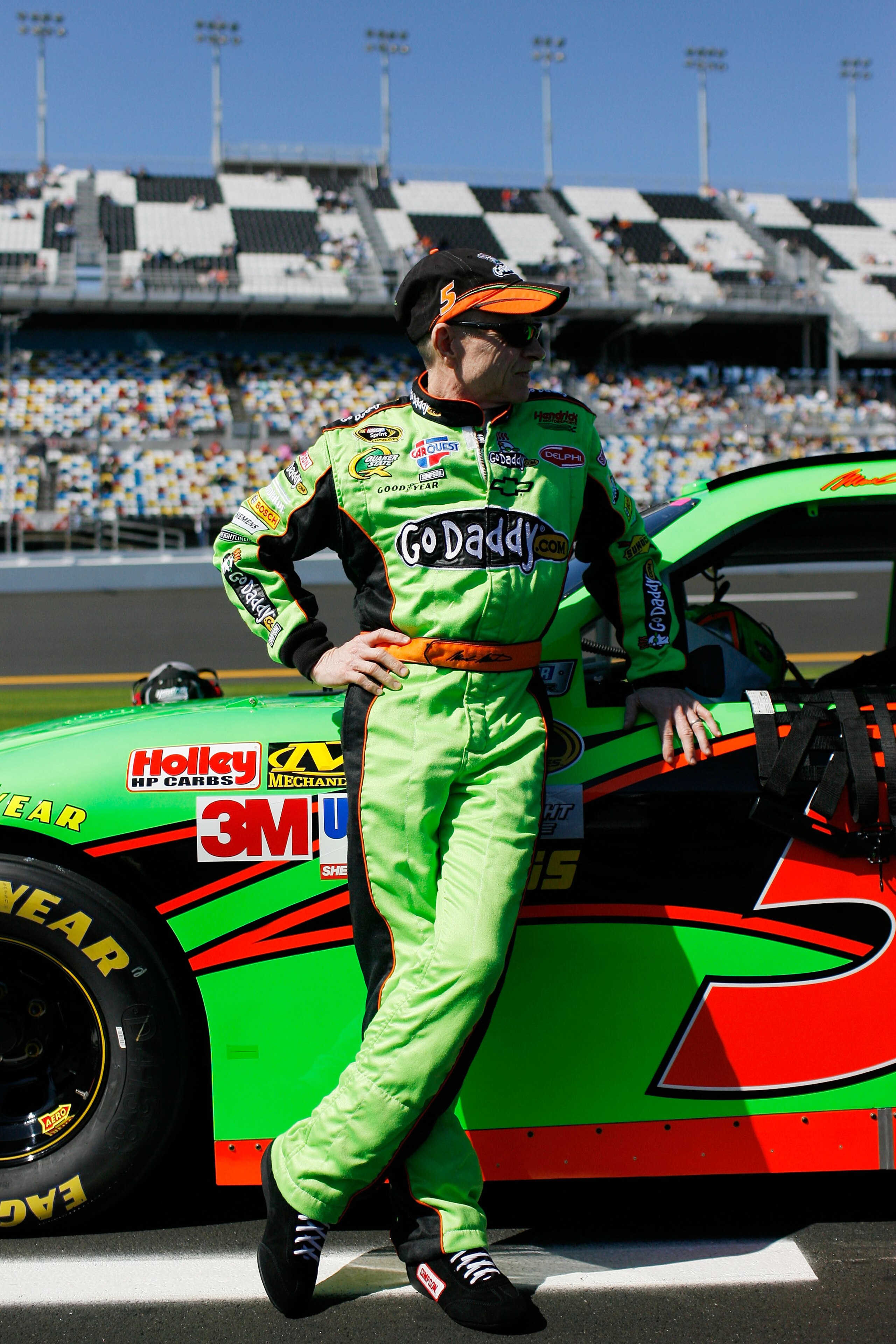 DAYTONA BEACH, FL - FEBRUARY 13:  Mark Martin, driver of the #5 GoDaddy.com Chevrolet, stands on the grid during qualifying for the NASCAR Sprint Cup Series Daytona 500 at Daytona International Speedway on February 13, 2011 in Daytona Beach, Florida.  (Ph
