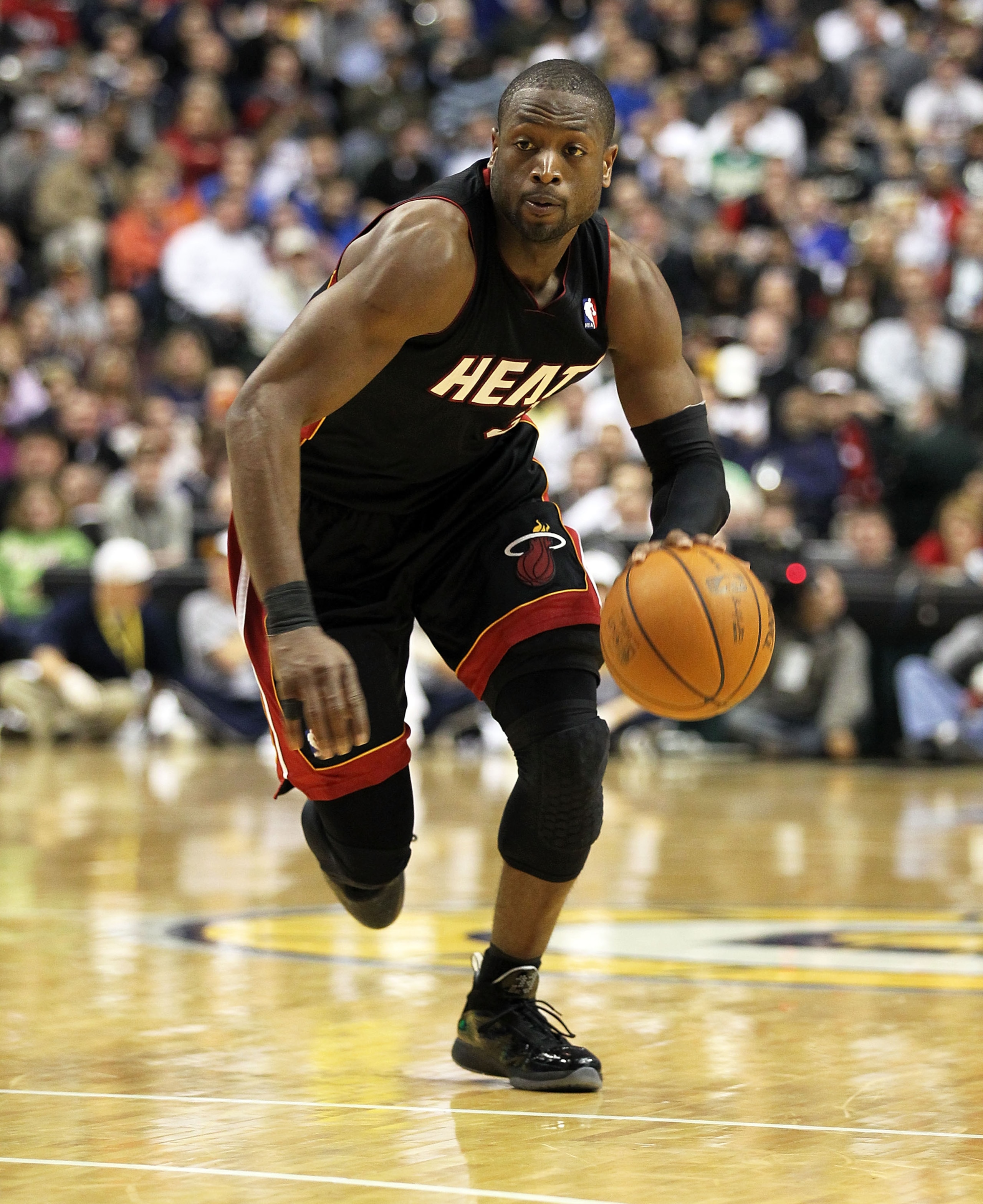 INDIANAPOLIS - FEBRUARY 15:  Dwyane Wade #3 of the Miami Heat dribbles the ball during the NBA game against the Indiana Pacers at Conseco Fieldhouse on February 15, 2011 in Indianapolis, Indiana.   The Heat won 110-103.   NOTE TO USER: User expressly ackn
