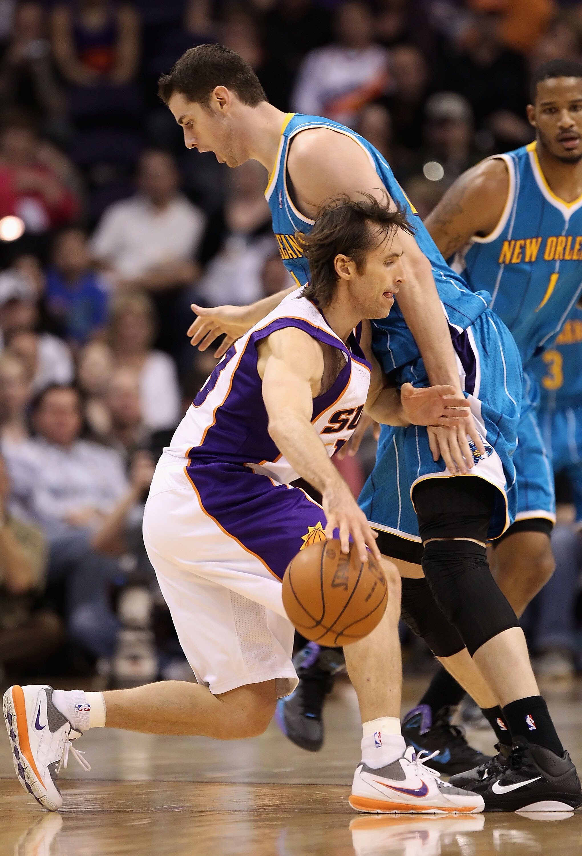 PHOENIX, AZ - JANUARY 30:  Steve Nash #13 of the Phoenix Suns handles the ball during the NBA game against the New Orleans Hornets at US Airways Center on January 30, 2011 in Phoenix, Arizona.  The Suns defeated the Hornets 104-102. NOTE TO USER: User exp