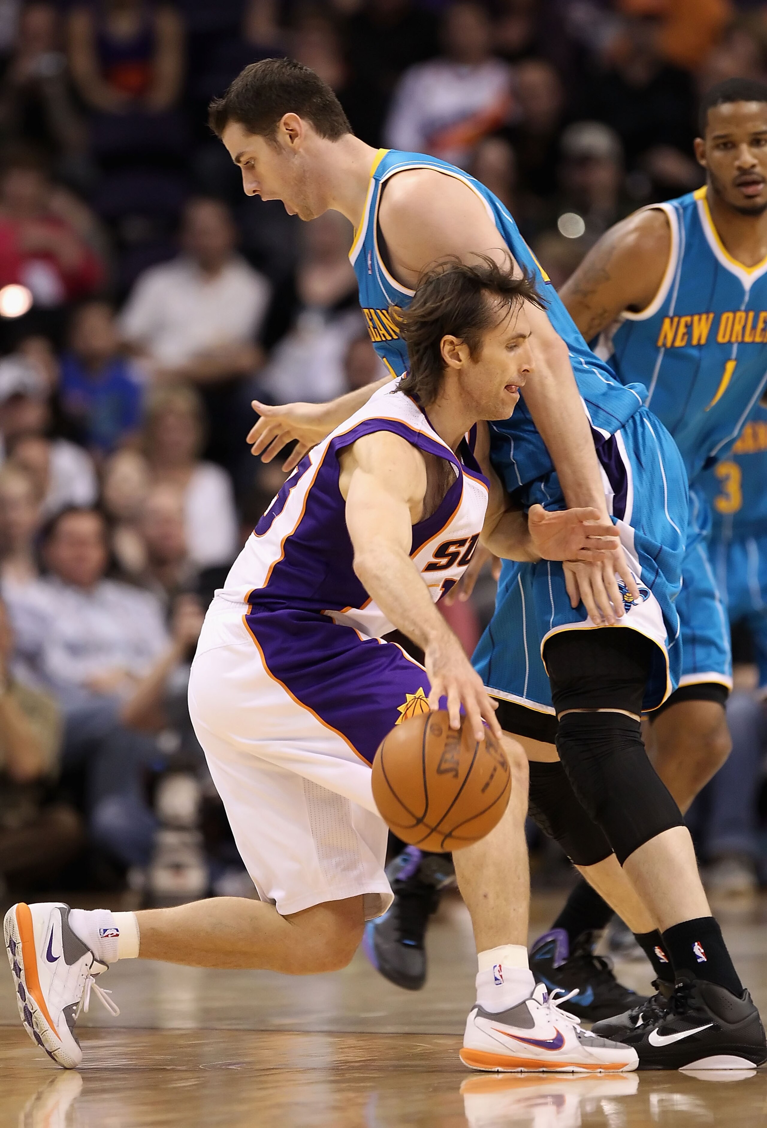PHOENIX, AZ - JANUARY 30:  Steve Nash #13 of the Phoenix Suns handles the ball during the NBA game against the New Orleans Hornets at US Airways Center on January 30, 2011 in Phoenix, Arizona.  The Suns defeated the Hornets 104-102. NOTE TO USER: User exp