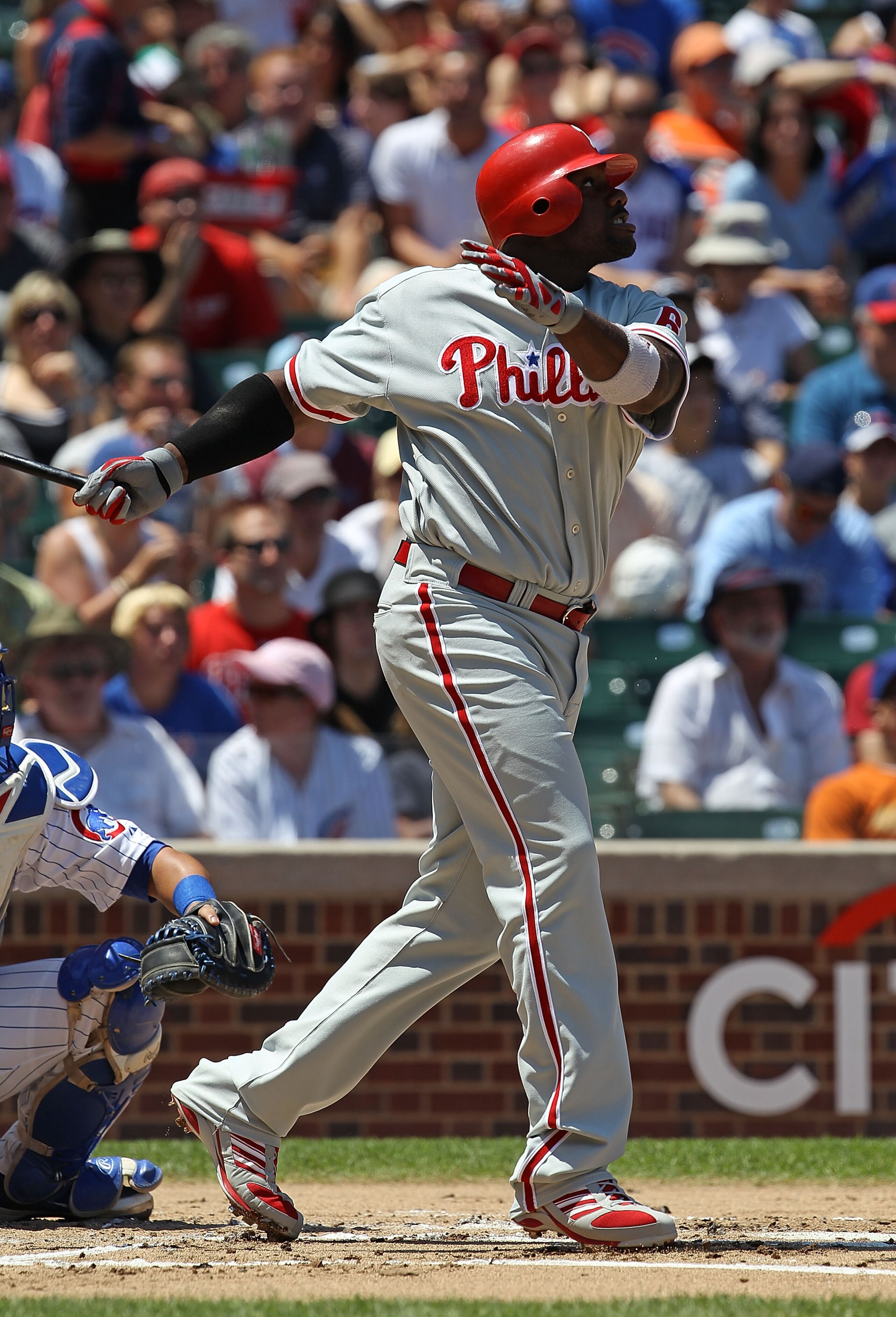 CHICAGO - JULY 16: Ryan Howard #6 of the Philadelphia Phillies watches the flight of the ball against the Chicago Cubs at Wrigley Field on July 16, 2010 in Chicago, Illinois. The Cubs defeated the Phillies 4-3. (Photo by Jonathan Daniel/Getty Images)