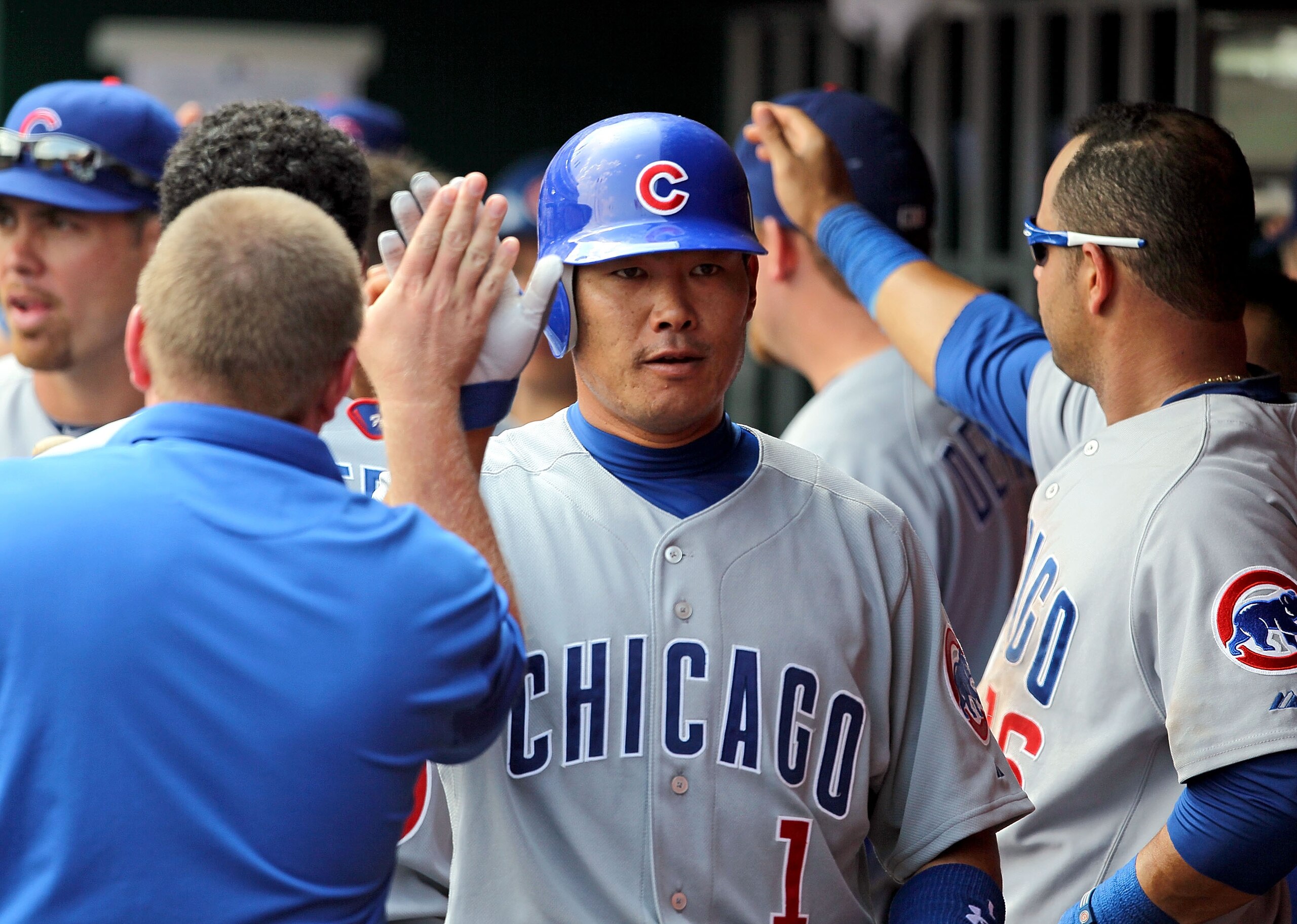 CINCINNATI - AUGUST 29:  Kosuke Fukudome #1 of the Chicago Cubs is congratulated after hitting a home run during the game against the Cincinnati Reds at Great American Ball Park on August 29, 2010 in Cincinnati, Ohio.  (Photo by Andy Lyons/Getty Images)