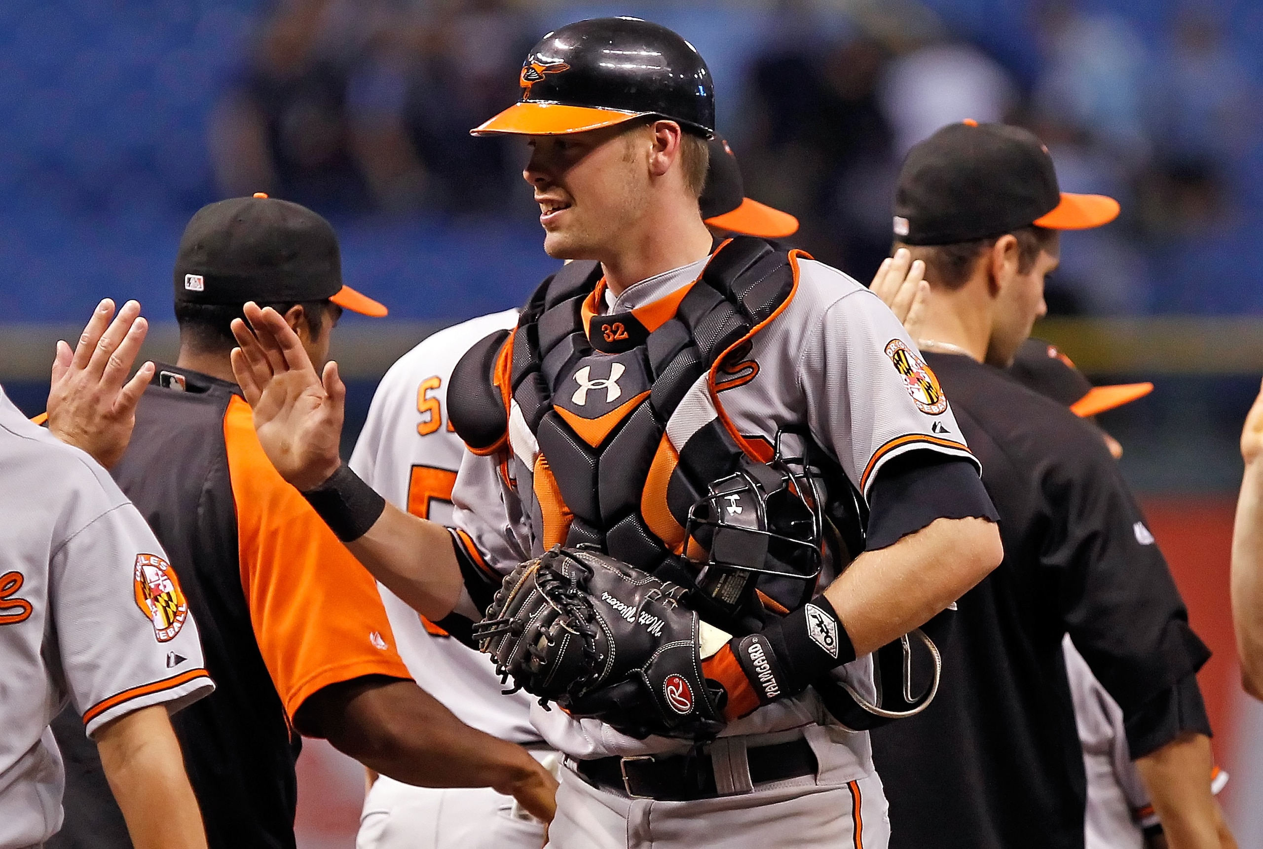 ST. PETERSBURG - SEPTEMBER 27:  Catcher Matt Wieters #32 of the Baltimore Orioles is congratulated after a victory over the Tampa Bay Rays at Tropicana Field on September 27, 2010 in St. Petersburg, Florida.  (Photo by J. Meric/Getty Images)