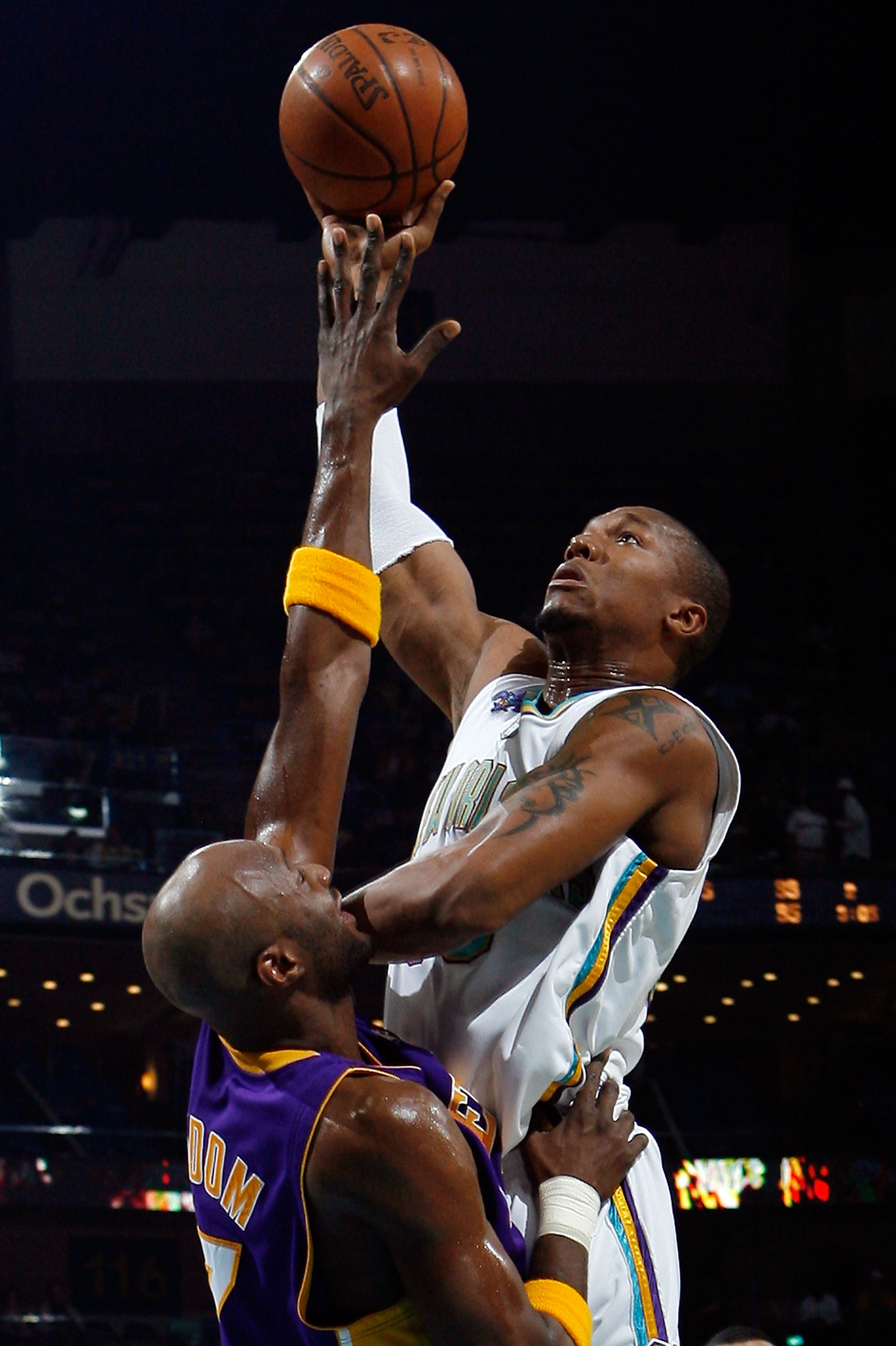 NEW ORLEANS - JANUARY 09:  David West #30 of the New Orleans Hornets makes a shot over Lamar Odom #7 of the Los Angeles Lakers on January 9, 2008 at the New Orleans Arena in New Orleans, Louisiana.  NOTE TO USER: User expressly acknowledges and agrees tha