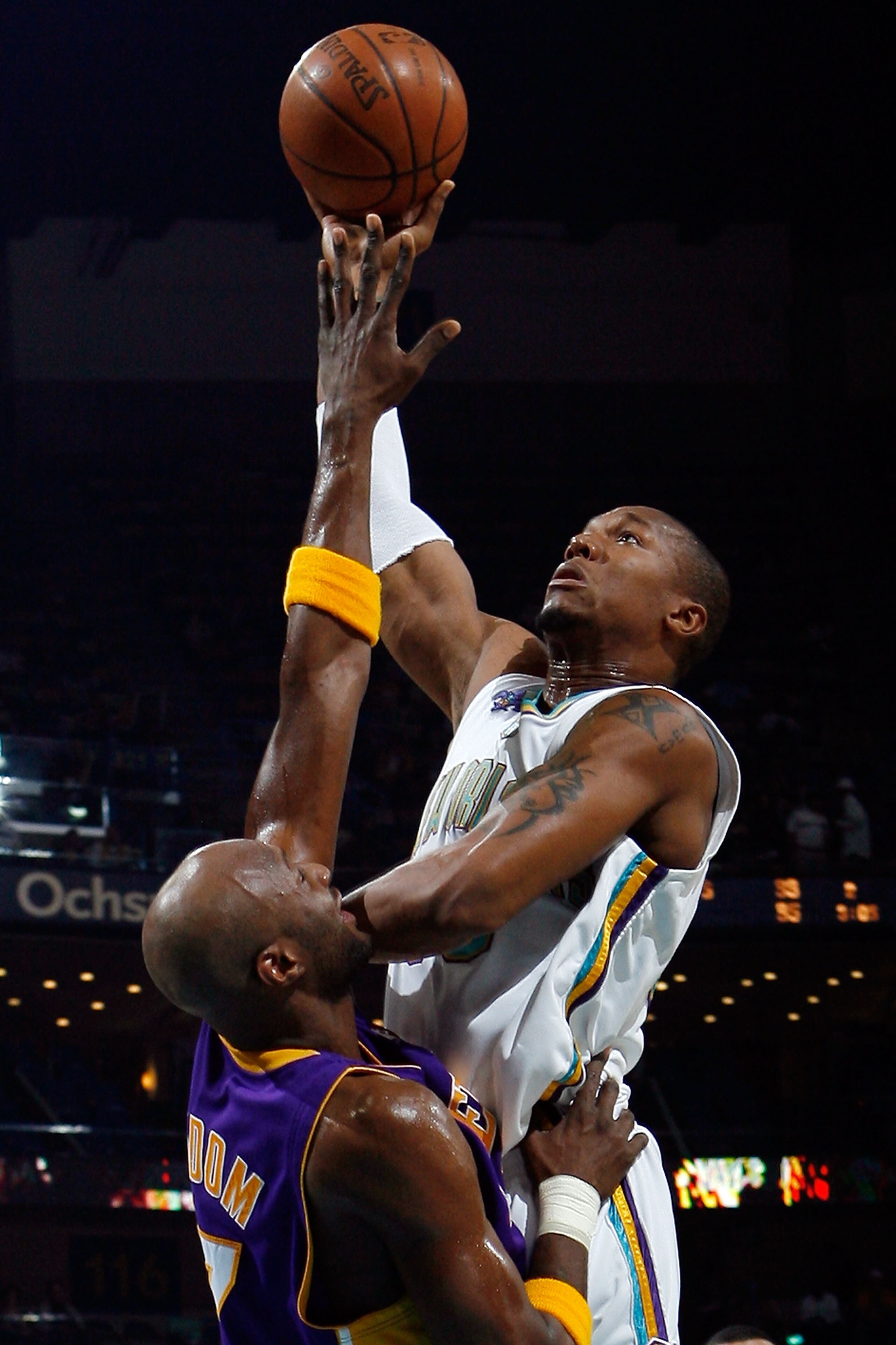 NEW ORLEANS - JANUARY 09:  David West #30 of the New Orleans Hornets makes a shot over Lamar Odom #7 of the Los Angeles Lakers on January 9, 2008 at the New Orleans Arena in New Orleans, Louisiana.  NOTE TO USER: User expressly acknowledges and agrees tha