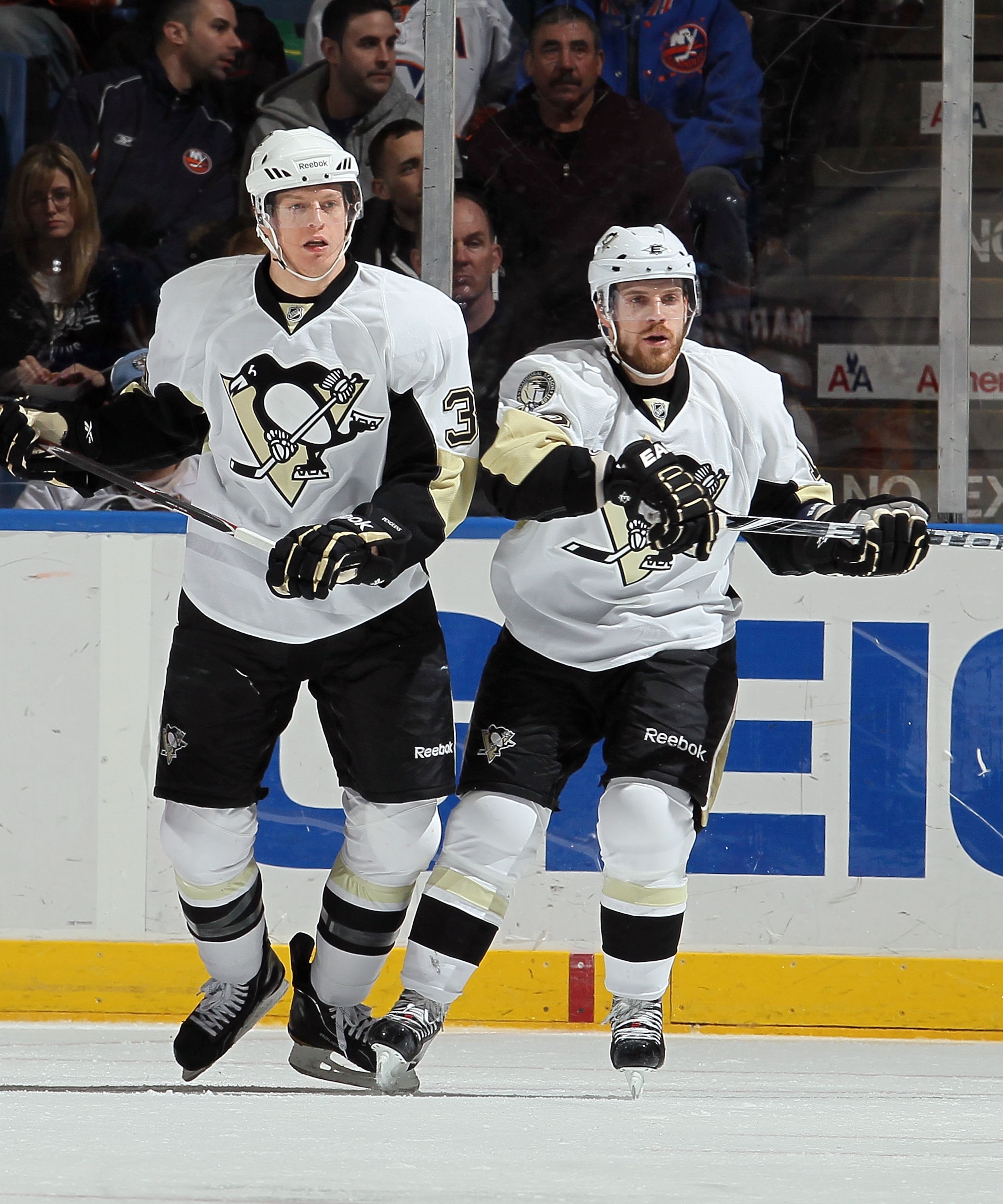 UNIONDALE, NY - FEBRUARY 11:  Nick Johnson #38 and Brett Sterling #12 of the Pittsburgh Penguins skates against the New York Islanders on February 11, 2011 at Nassau Coliseum in Uniondale, New York. The Isles defeated the Pens 9-3.  (Photo by Jim McIsaac/