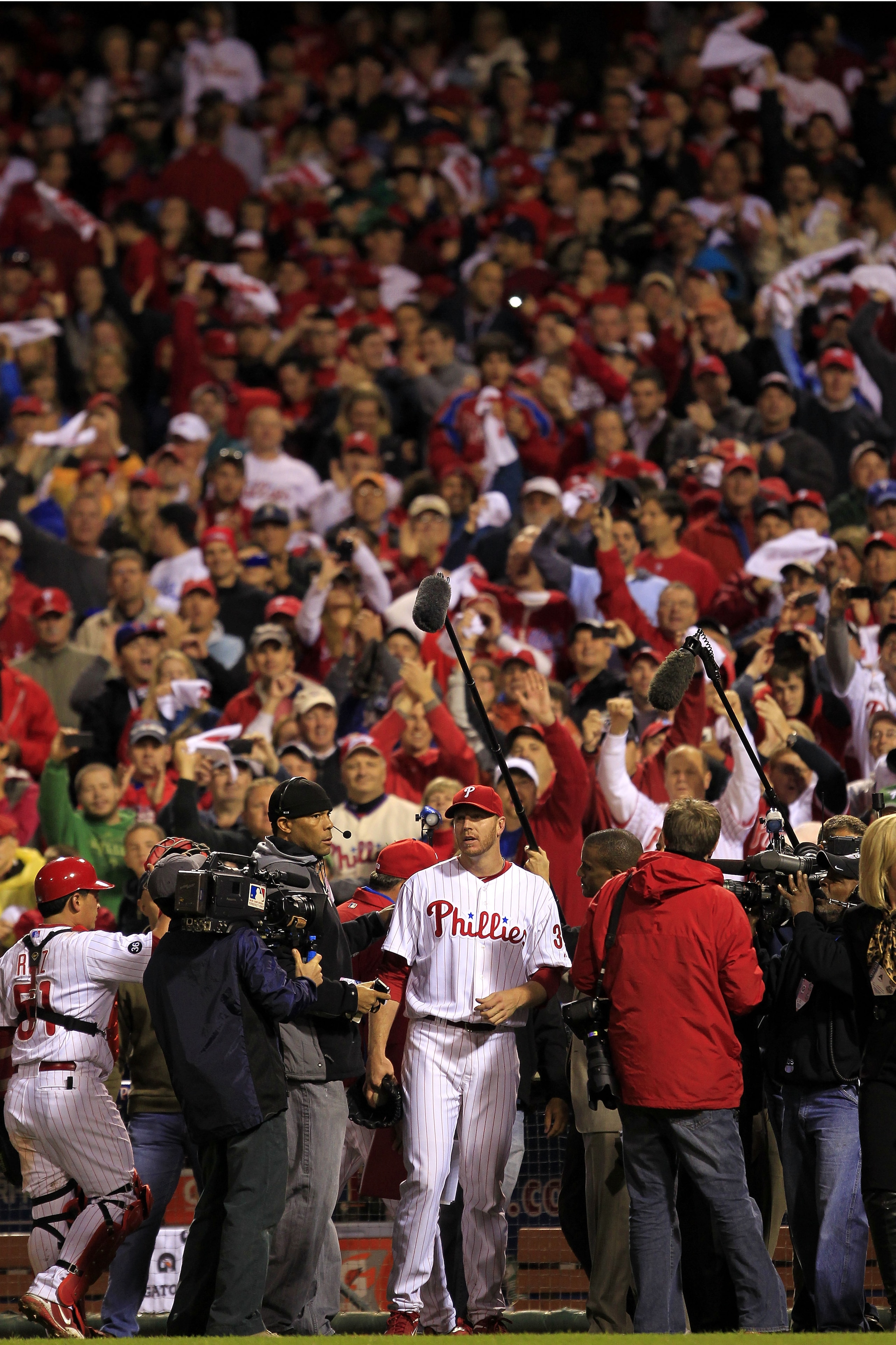PHILADELPHIA - OCTOBER 06:  Roy Halladay #34 of the Philadelphia Phillies talks to the media following  his no-hitter in Game 1 of the NLDS against the Cincinnati Reds at Citizens Bank Park on October 6, 2010 in Philadelphia, Pennsylvania.The Phillies def