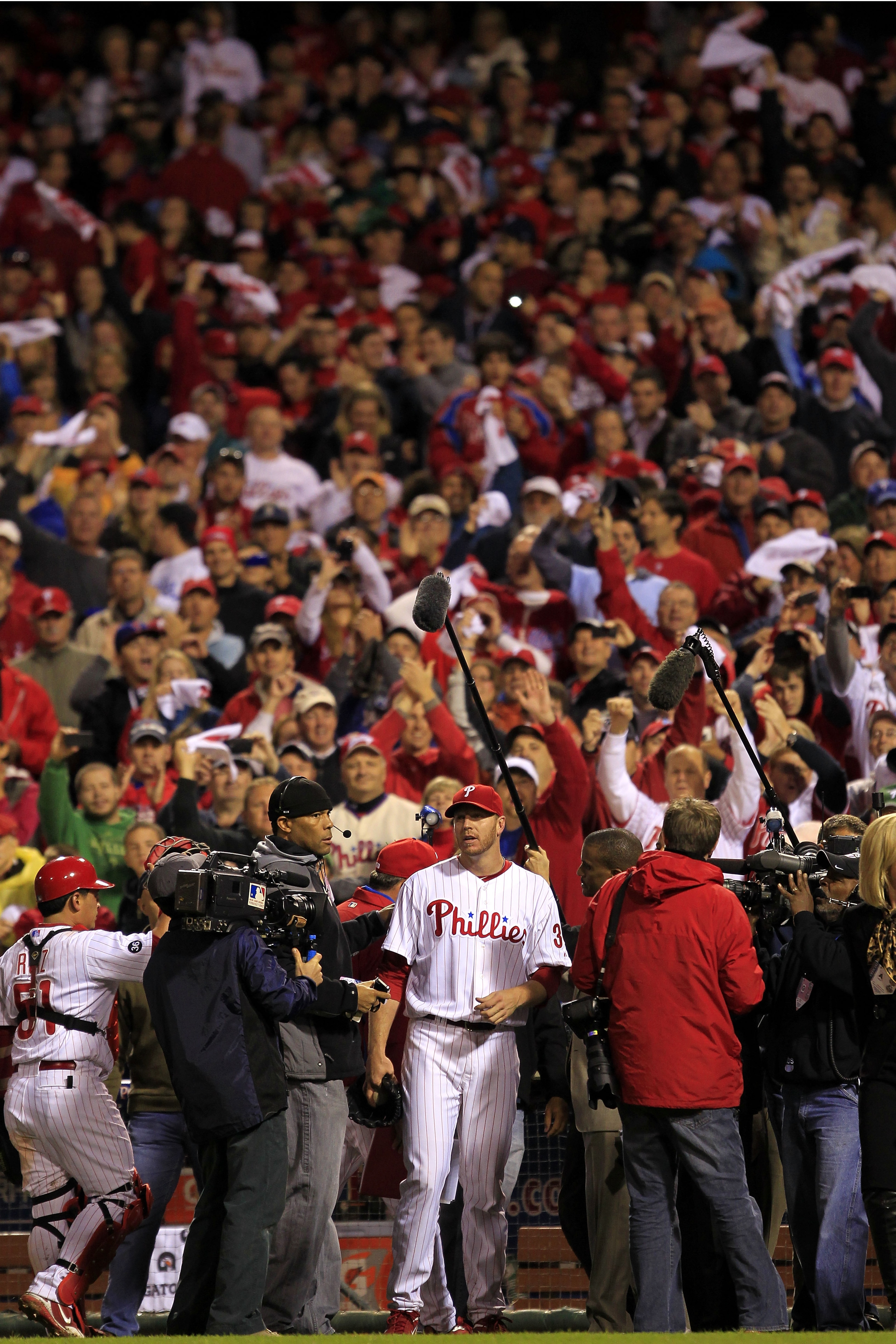 PHILADELPHIA - OCTOBER 06:  Roy Halladay #34 of the Philadelphia Phillies talks to the media following  his no-hitter in Game 1 of the NLDS against the Cincinnati Reds at Citizens Bank Park on October 6, 2010 in Philadelphia, Pennsylvania.The Phillies def
