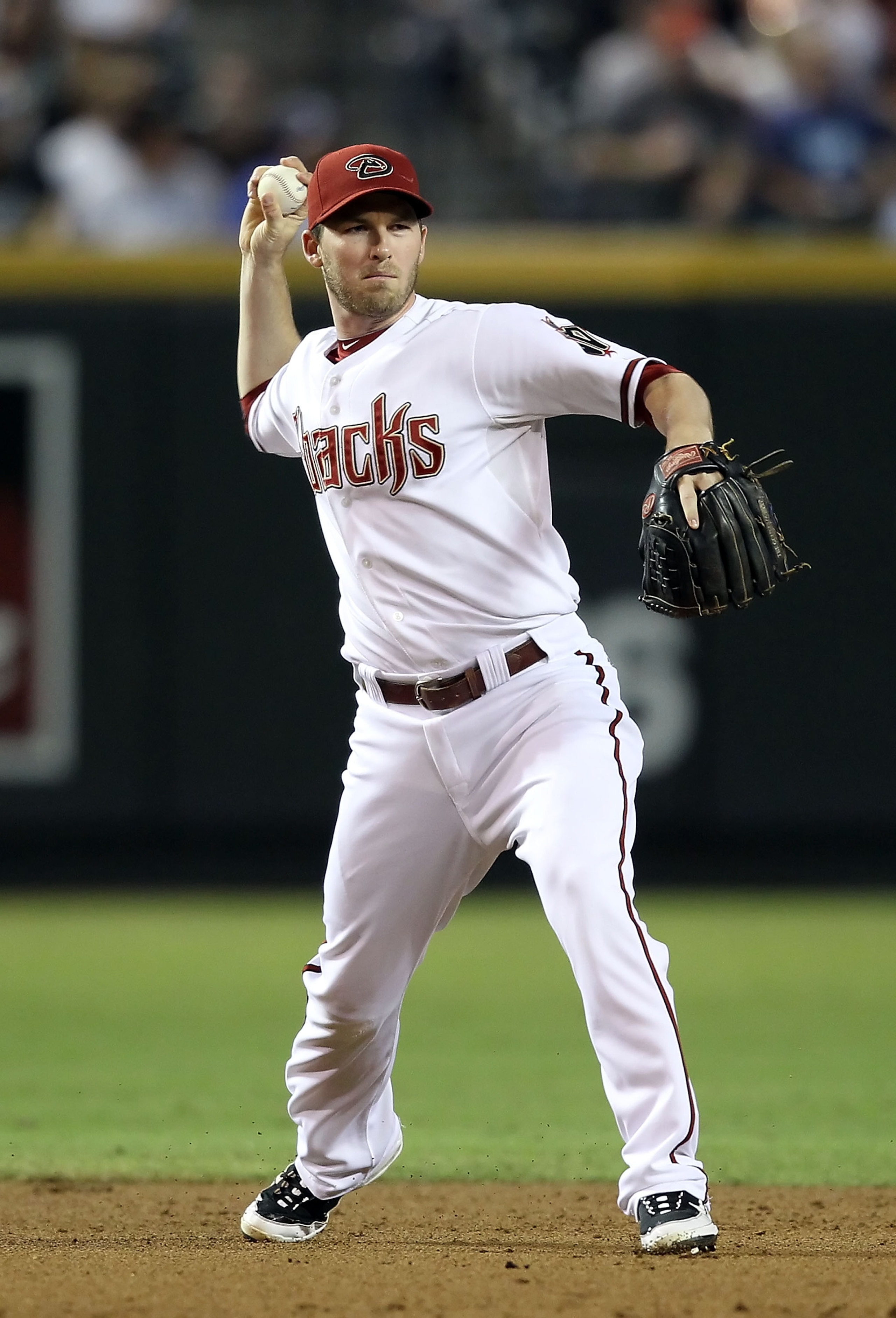 PHOENIX - SEPTEMBER 24:  Infielder Stephen Drew #6 of the Arizona Diamondbacks fields a ground ball out during the Major League Baseball game against the Los Angeles Dodgers at Chase Field on September 24, 2010 in Phoenix, Arizona.  (Photo by Christian Pe