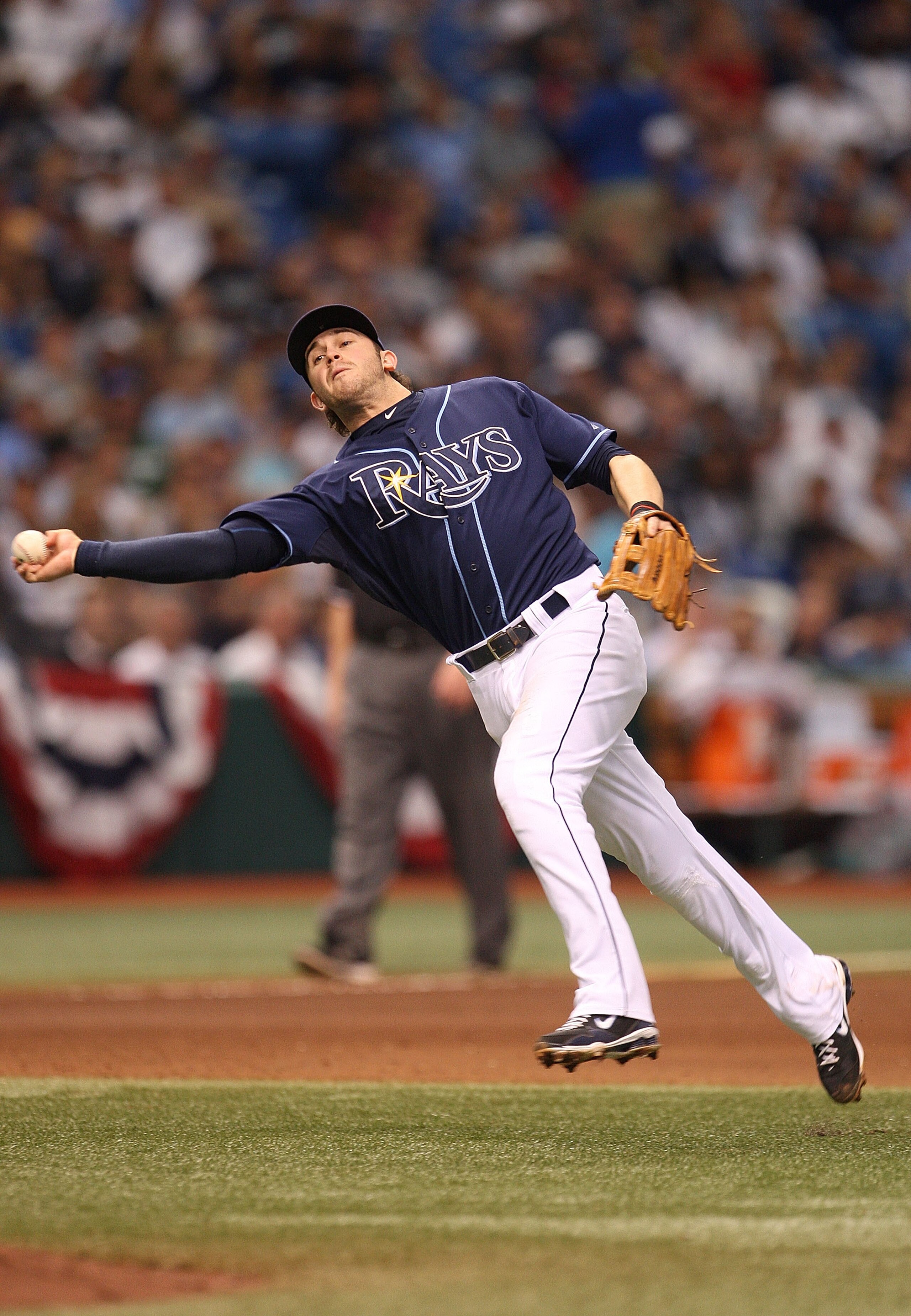 ST PETERSBURG, FL - OCTOBER 07: Evan Longoria #3 of the Tampa Bay Rays makes a throw to first during Game 2 of the ALDS against the Texas Rangers at Tropicana Field on October 7, 2010 in St. Petersburg, Florida.  (Photo by Mike Ehrmann/Getty Images)