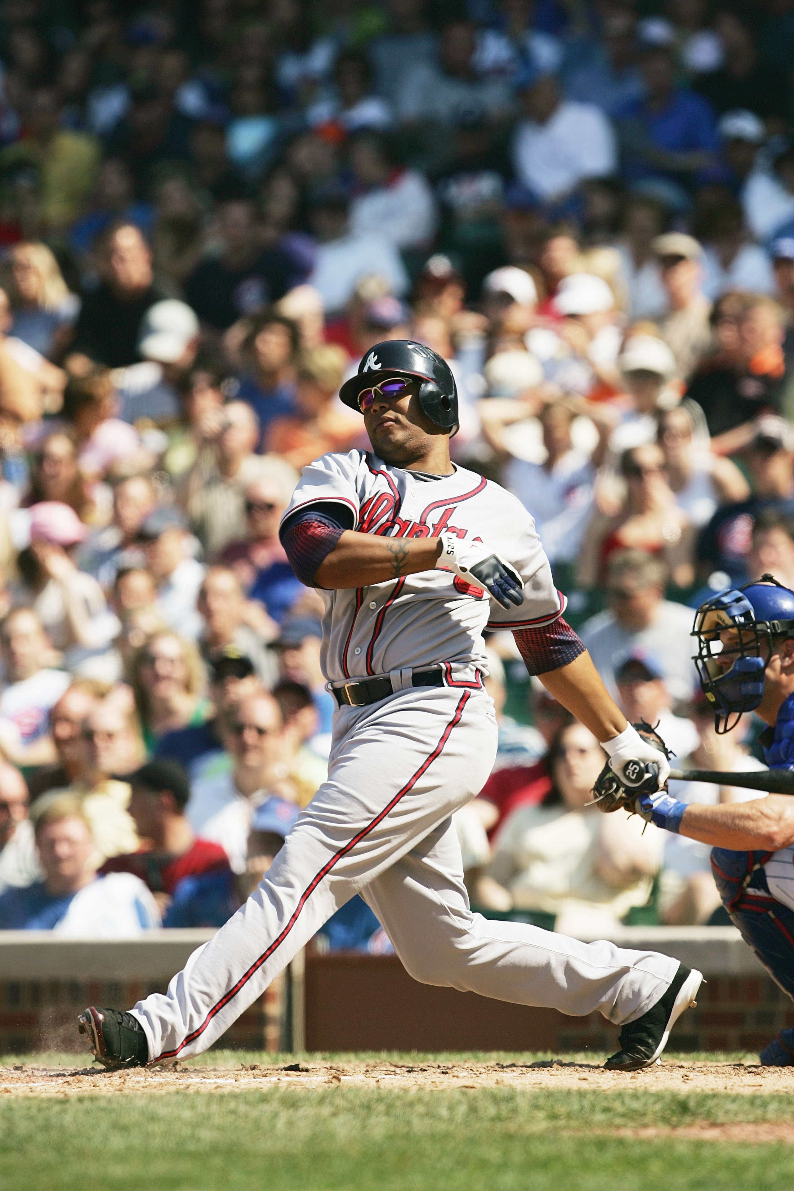 CHICAGO - MAY 26:  Andruw Jones #25 of the Atlanta Braves bats against the Chicago Cubs on May 26, 2006 at Wrigley Field in Chicago, Illinois. The Braves defeated the Cubs 6-5.  (Photo by Jonathan Daniel/Getty Images)