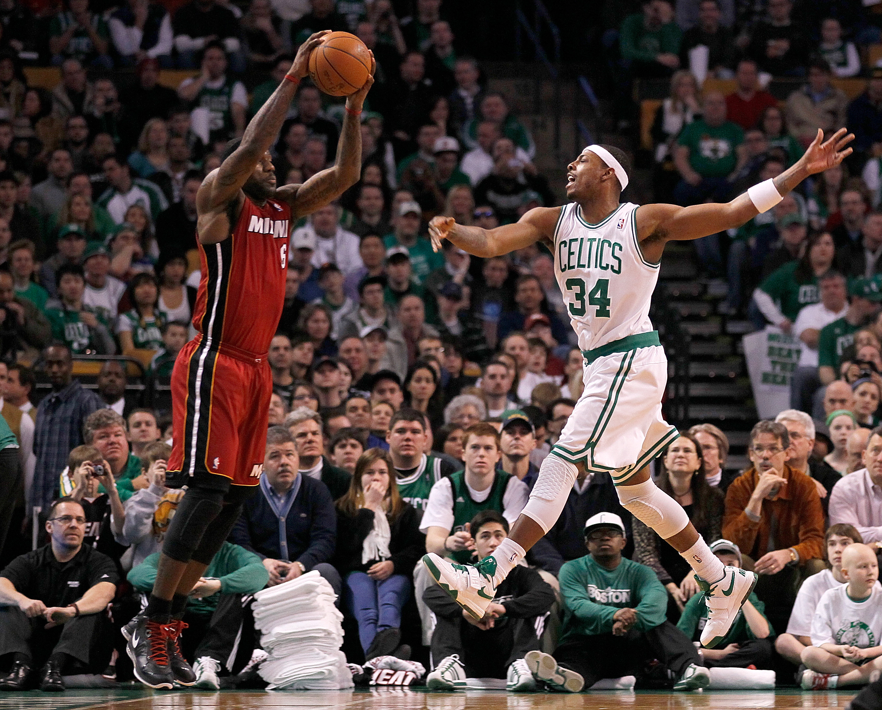 BOSTON - FEBRUARY 13:  LeBron James #6 of the Miami Heat looks to pass against Paul Pierce #34 of the Boston Celtics at TD Garden on February 13, 2011 in Boston, Massachusetts. NOTE TO USER: User expressly acknowledges and agrees that, by downloading and/