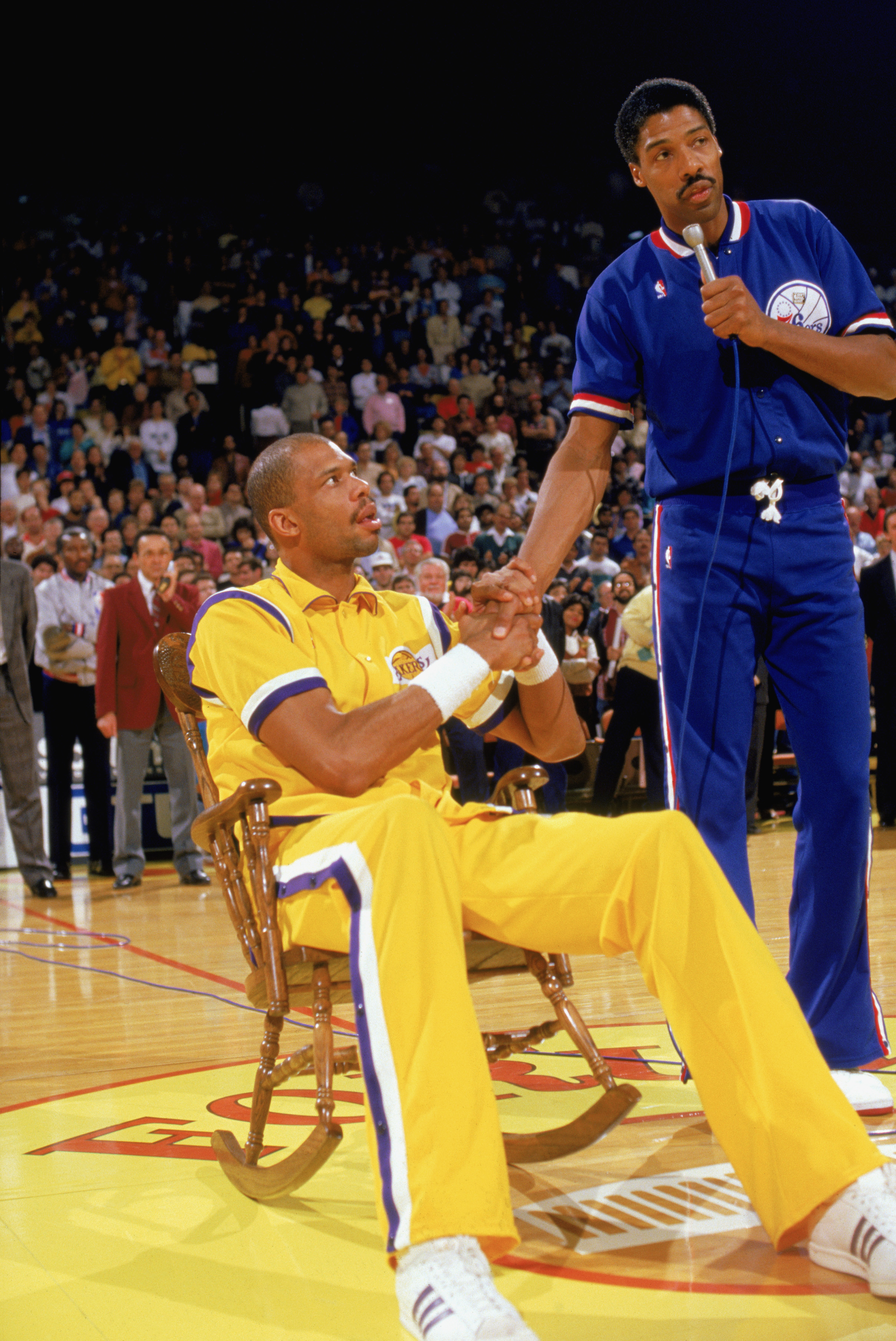 LOS ANGELES - 1987:  Julius Erving #6 of the Philadelphia 76ers (right) talks to fellow legend Kareem Abdul-Jabbar #33 of the Los Angeles Lakers before Erving played the final game of his career against Lakers, which happened to be at the Great Western Fo