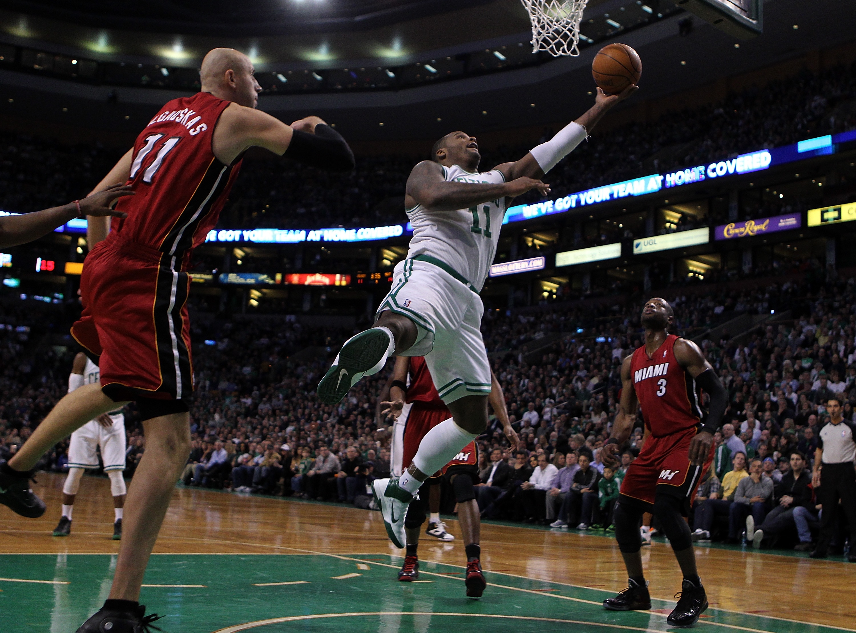 BOSTON - FEBRUARY 13: Glen Davis #11 of the Boston Celtics drives against Zydrunas Ilgauskas #11 of the Miami Heat at TD Garden on February 13, 2011 in Boston, Massachusetts. The Celtics won 85-82. NOTE TO USER: User expressly acknowledges and agrees tha