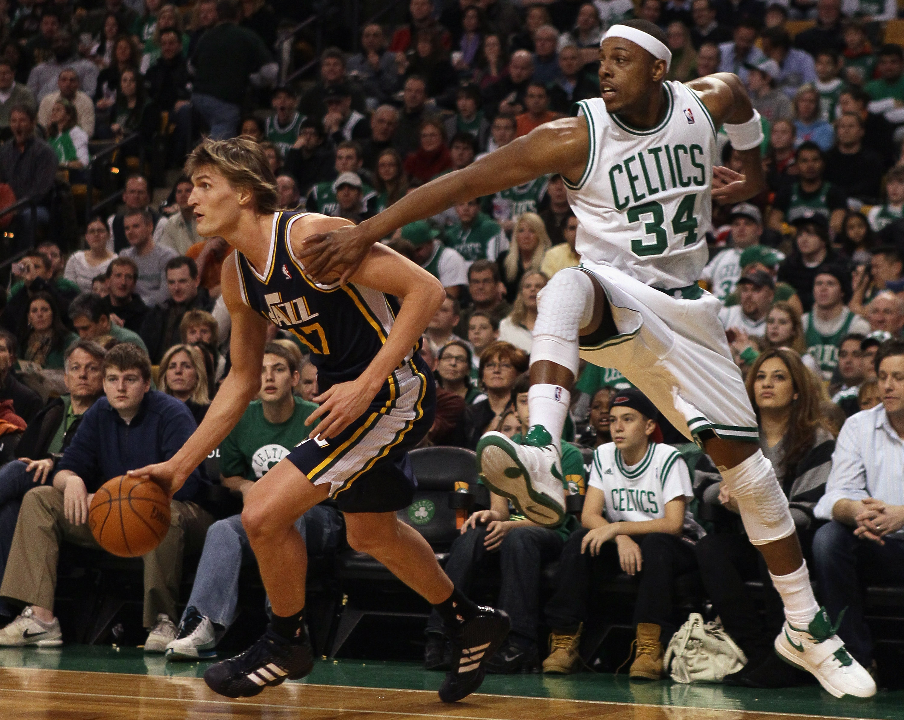 BOSTON, MA - JANUARY 21:  Andrei Kirilenko #47 of the Utah Jazz tries to keep the ball as Paul Pierce #34 of the Boston Celtics jumps to block on January 21, 2011 at the TD Garden in Boston, Massachusetts.  NOTE TO USER: User expressly acknowledges and ag