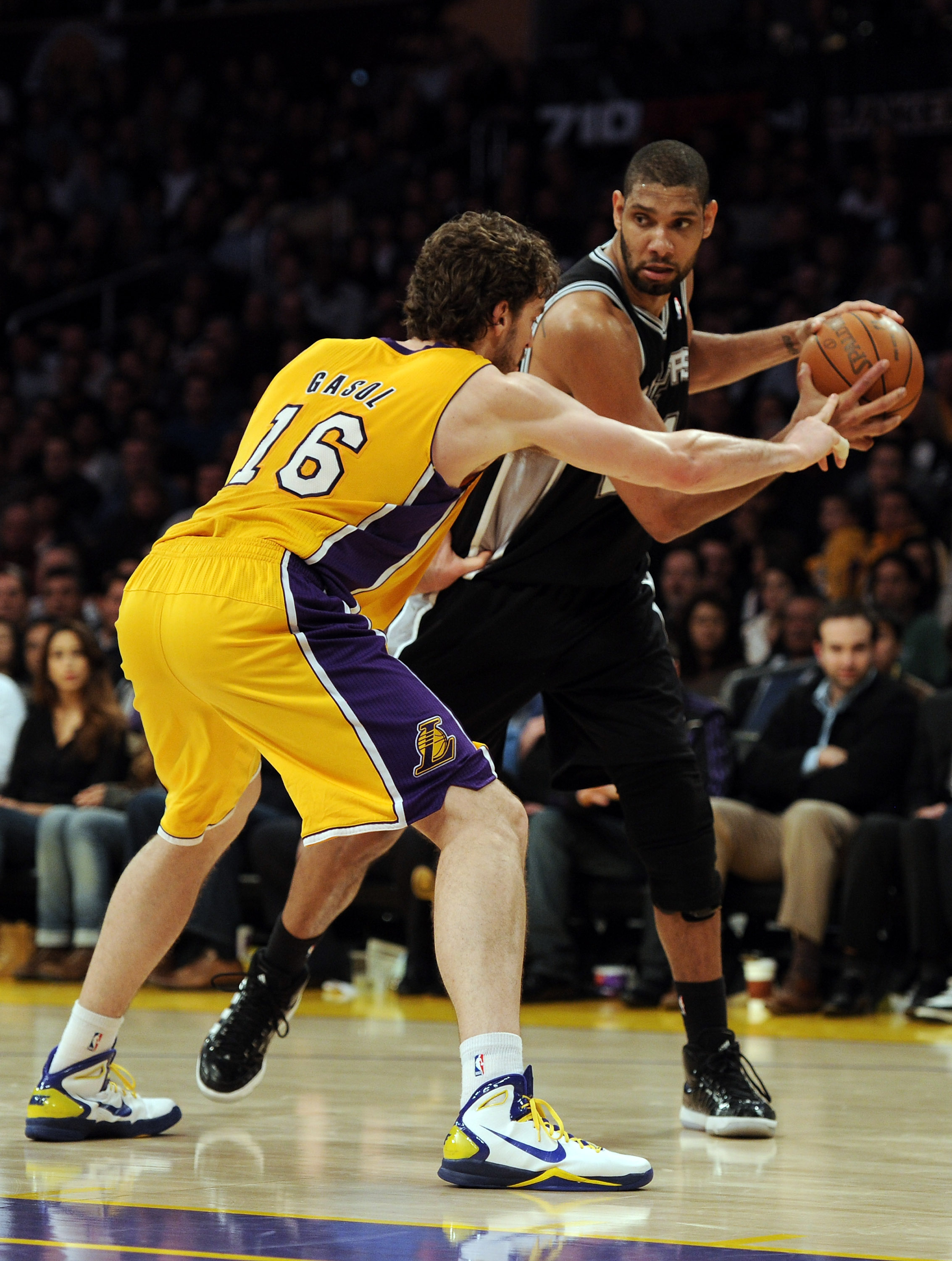 LOS ANGELES, CA - FEBRUARY 03:  Tim Duncan #21 of the San Antonio Spurs faces off against Pau Gasol #16 of the Los Angeles Lakers during a 89-88 Spur victory at Staples Center on February 3, 2011 in Los Angeles, California.  NOTE TO USER: User expressly a