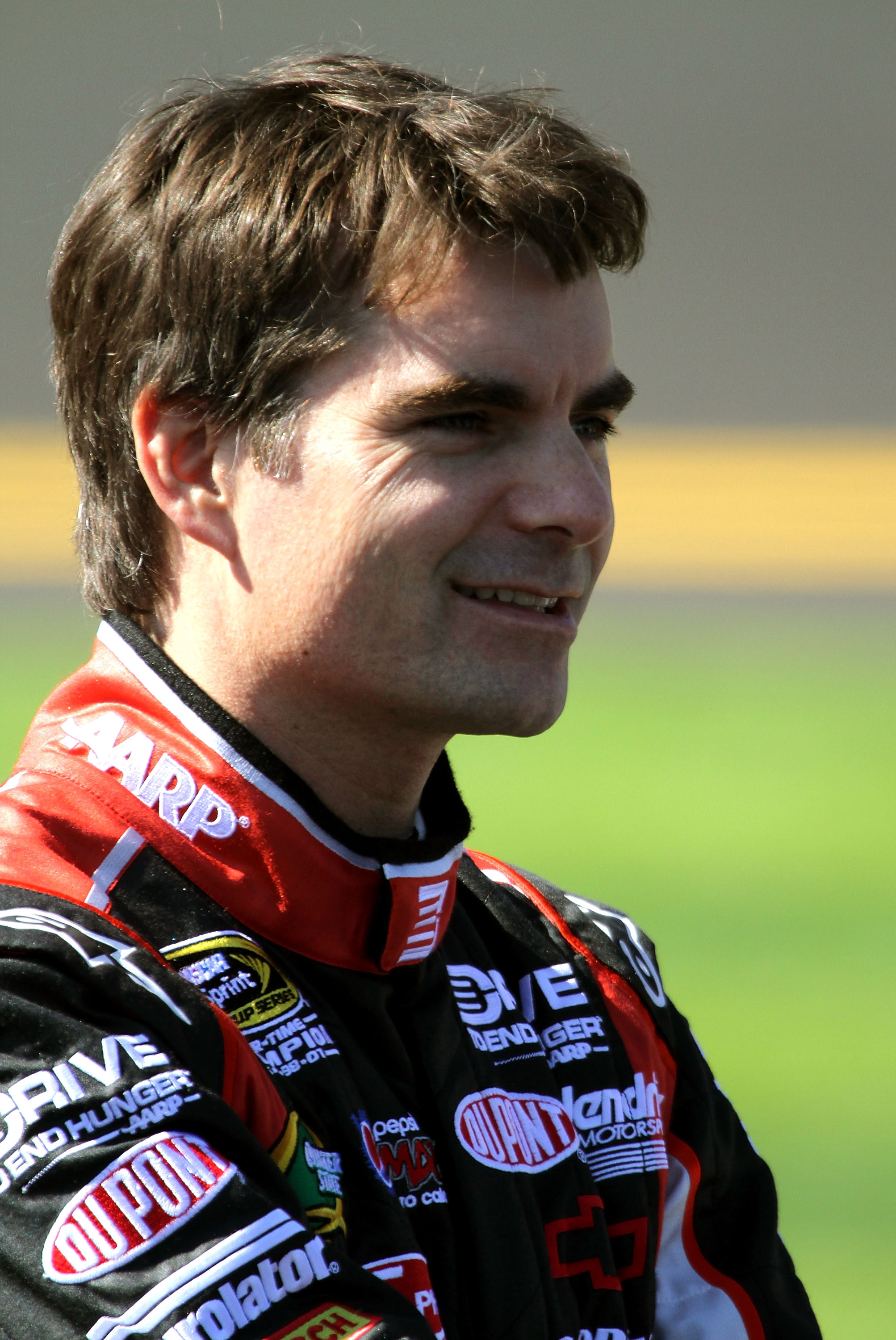 DAYTONA BEACH, FL - FEBRUARY 13:  Jeff Gordon, driver of the #24 Drive to End Hunger Chevrolet, stands on the grid during qualifying for the NASCAR Sprint Cup Series Daytona 500 at Daytona International Speedway on February 13, 2011 in Daytona Beach, Flor