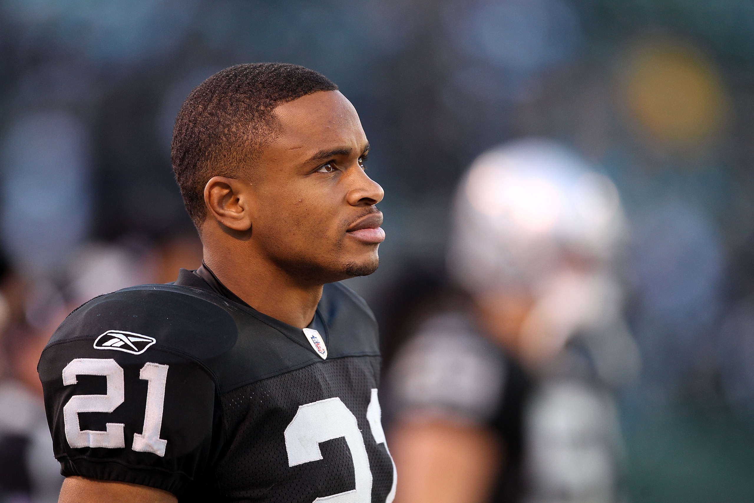 OAKLAND, CA - NOVEMBER 28: Nnamdi Asomugha #21 of the Oakland Raiders stands on the sidelines during the closing minutes of their loss to the Miami Dolphins at Oakland-Alameda County Coliseum on November 28, 2010 in Oakland, California. (Photo by Ezra S OAKLAND, CA - NOVEMBER 28: Nnamdi Asomugha #21 of the Oakland Raiders stands on the sidelines during the closing minutes of their loss to the Miami Dolphins at Oakland-Alameda County Coliseum on November 28, 2010 in Oakland, California. (Photo by Ezra S