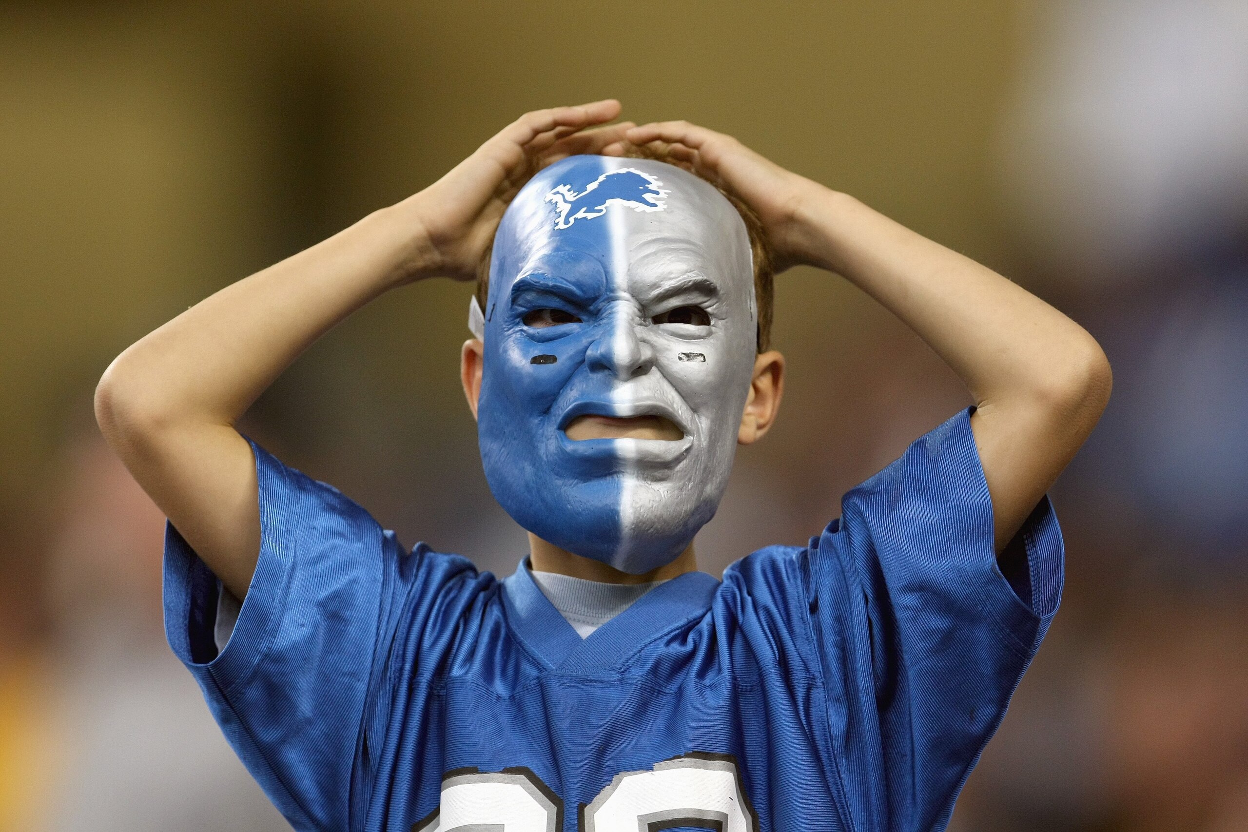 DETROIT - SEPTEMBER 30: A young fan of the Detroit Lions wears a mask during the game against the Chicago Bears on September 30, 2007 at Ford Field in Detroit, Michigan. The Lions defeated the Bears 37-27. (Photo by Jonathan Daniel/Getty Images)