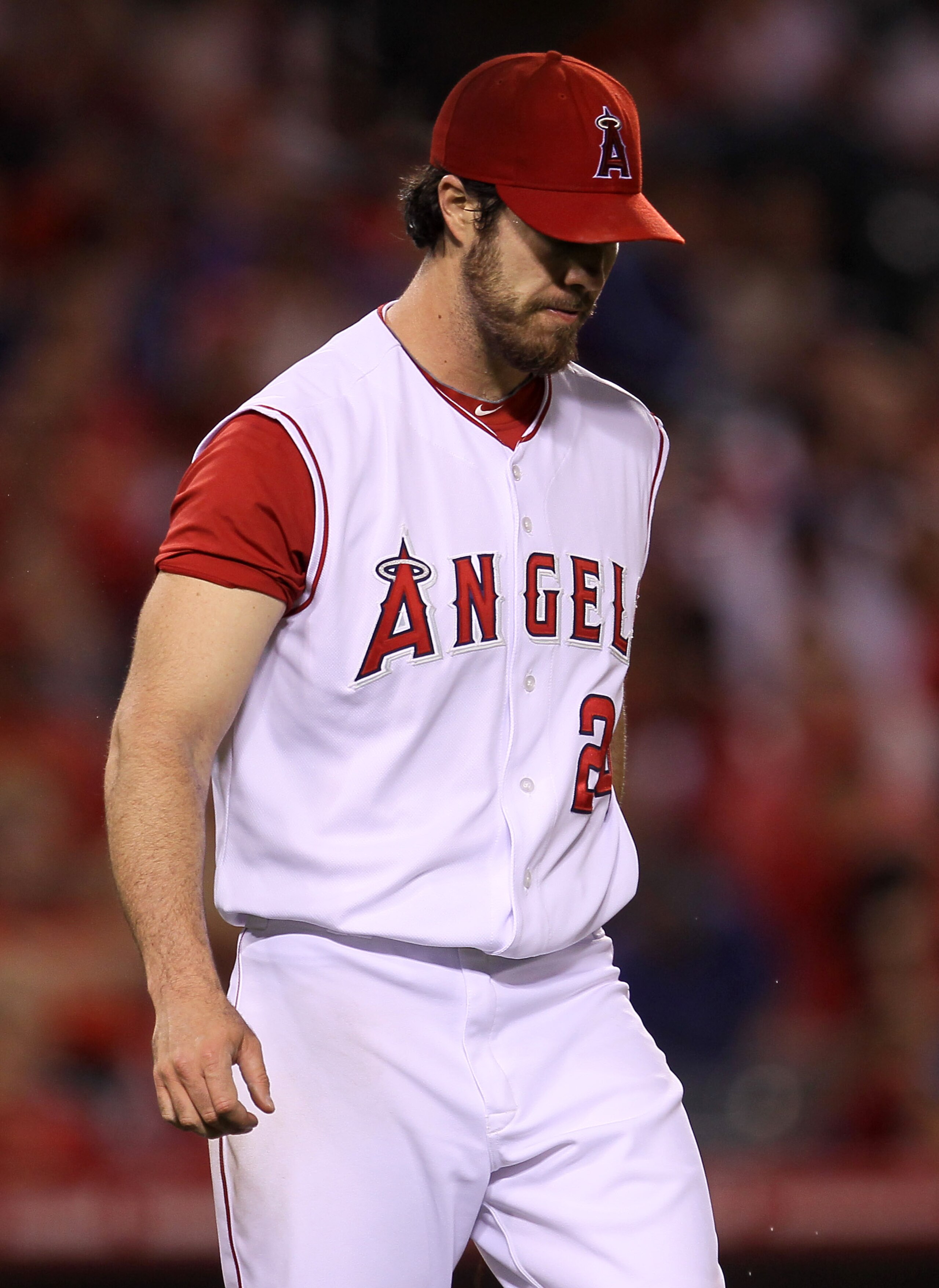 ANAHEIM, CA - SEPTEMBER 06:  Pitcher Dan Haren #24 of the Los Angeles Angels of Anaheim reacts after walking in a run in the sixth inning against the Cleveland Indians on September 6, 2010 at Angel Stadium in Anaheim, California.  (Photo by Stephen Dunn/G