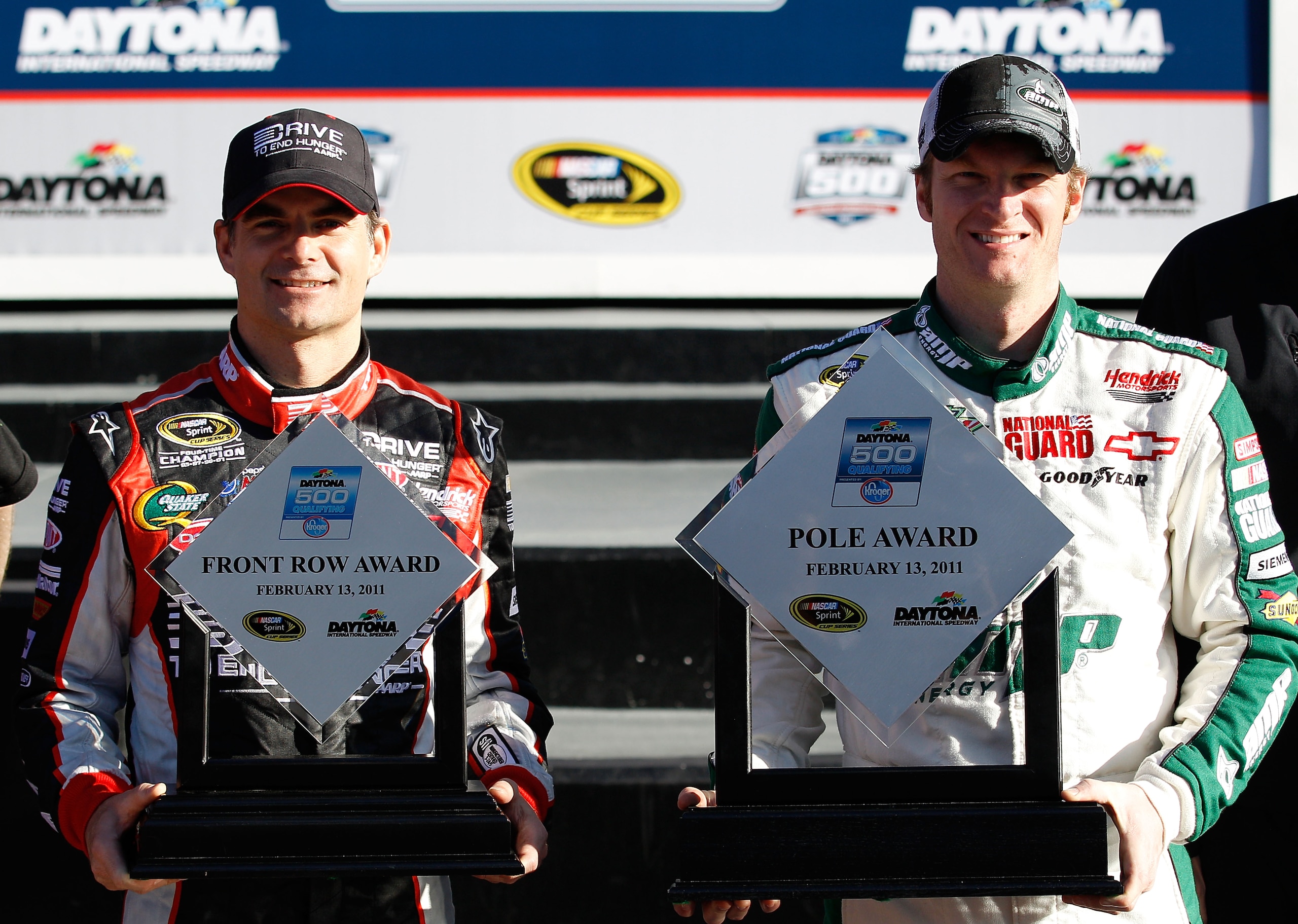 DAYTONA BEACH, FL - FEBRUARY 13:  Front Row award winner Jeff Gordon, driver of the #24 Drive to End Hunger Chevrolet, and Pole award winner Dale Earnhardt Jr., driver of the #88 National Guard/AMP Energy Chevrolet, pose in victory lane after qualifying f