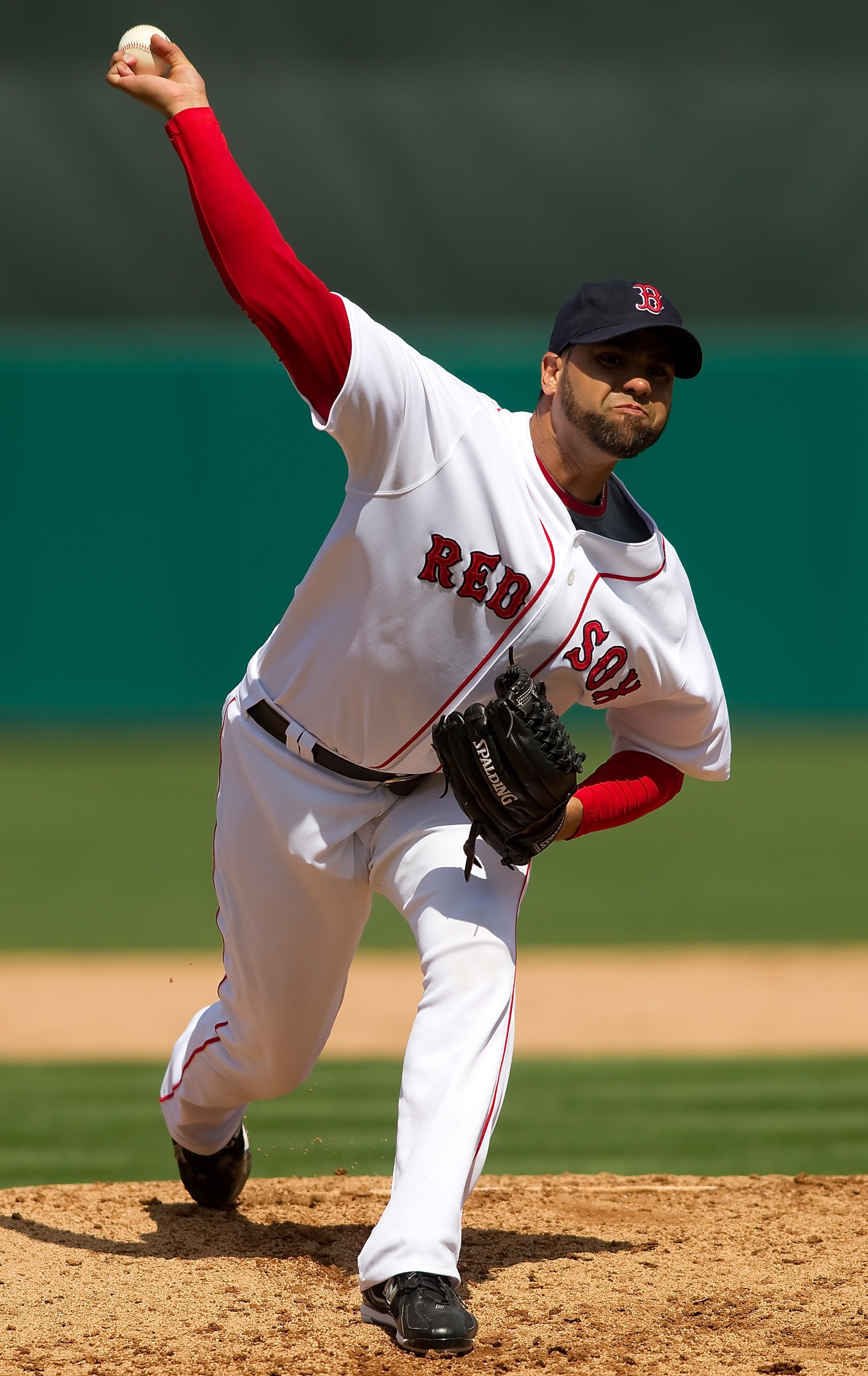 FORT MYERS, FL - MARCH 13:  Pitcher Manny Delcarmen #17 of the Boston Red Sox pitches against the Pittsburgh Pirates during a Grapefruit League Spring Training Game at City of Palms Park on March 13, 2010 in Fort Myers, Florida.  (Photo by J. Meric/Getty