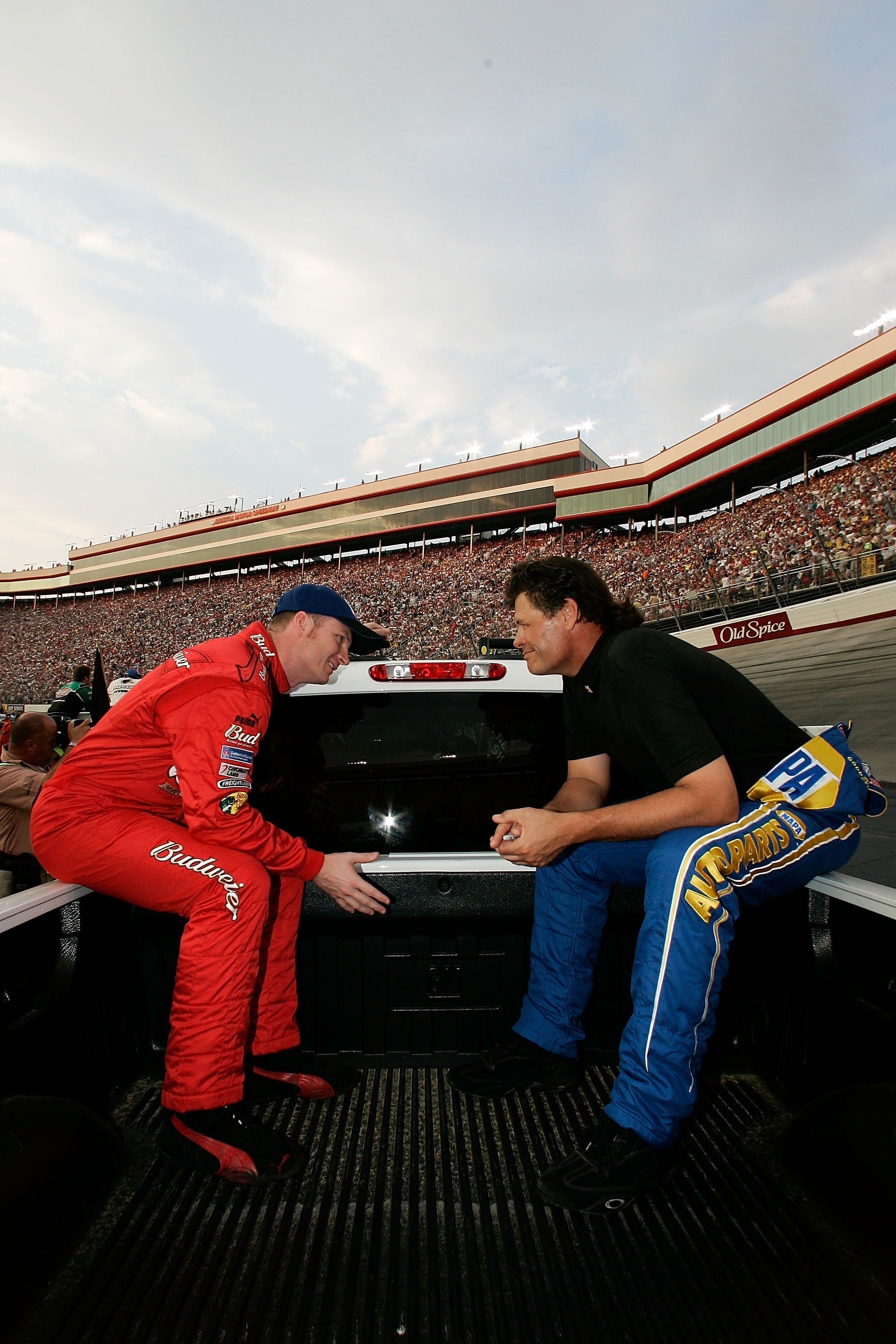 BRISTOL, TN - AUGUST 25:  Dale Earnhardt Jr., driver of the #8 Budweiser Chevrolet, talks with Michael Waltrip, driver of the #55 NAPA Auto Parts Toyota, during the NASCAR Nextel Cup Series Sharpie 500 at Bristol Motor Speedway on August 25, 2007 in Brist