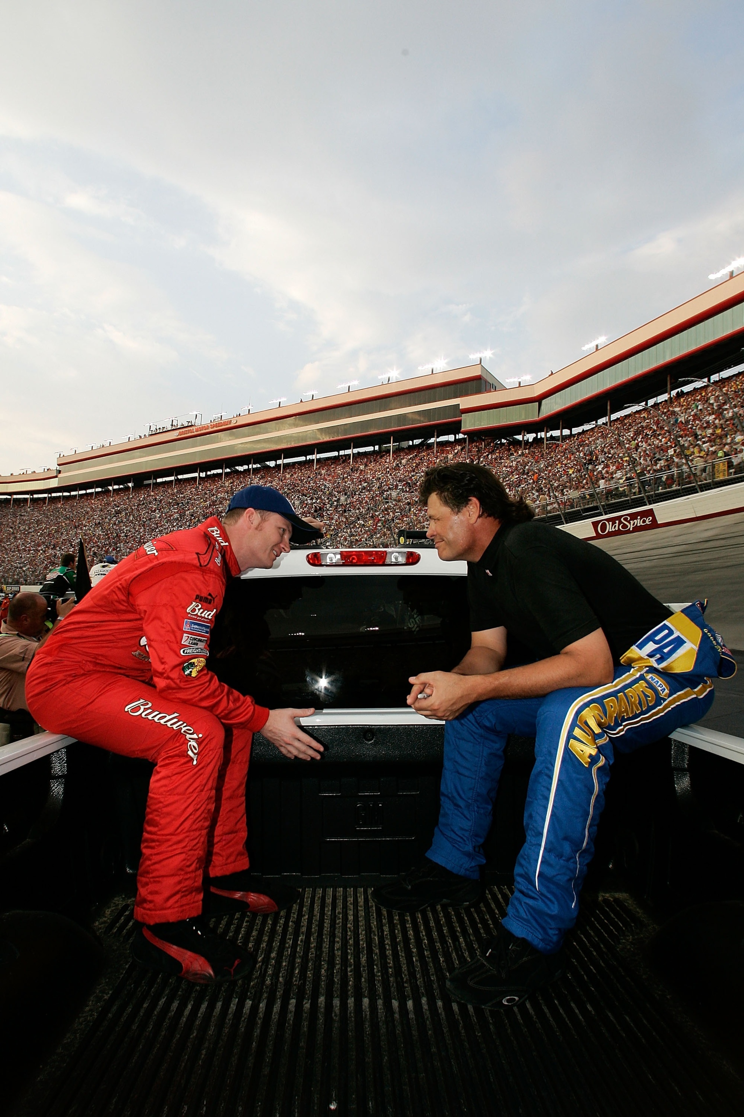 BRISTOL, TN - AUGUST 25:  Dale Earnhardt Jr., driver of the #8 Budweiser Chevrolet, talks with Michael Waltrip, driver of the #55 NAPA Auto Parts Toyota, during the NASCAR Nextel Cup Series Sharpie 500 at Bristol Motor Speedway on August 25, 2007 in Brist