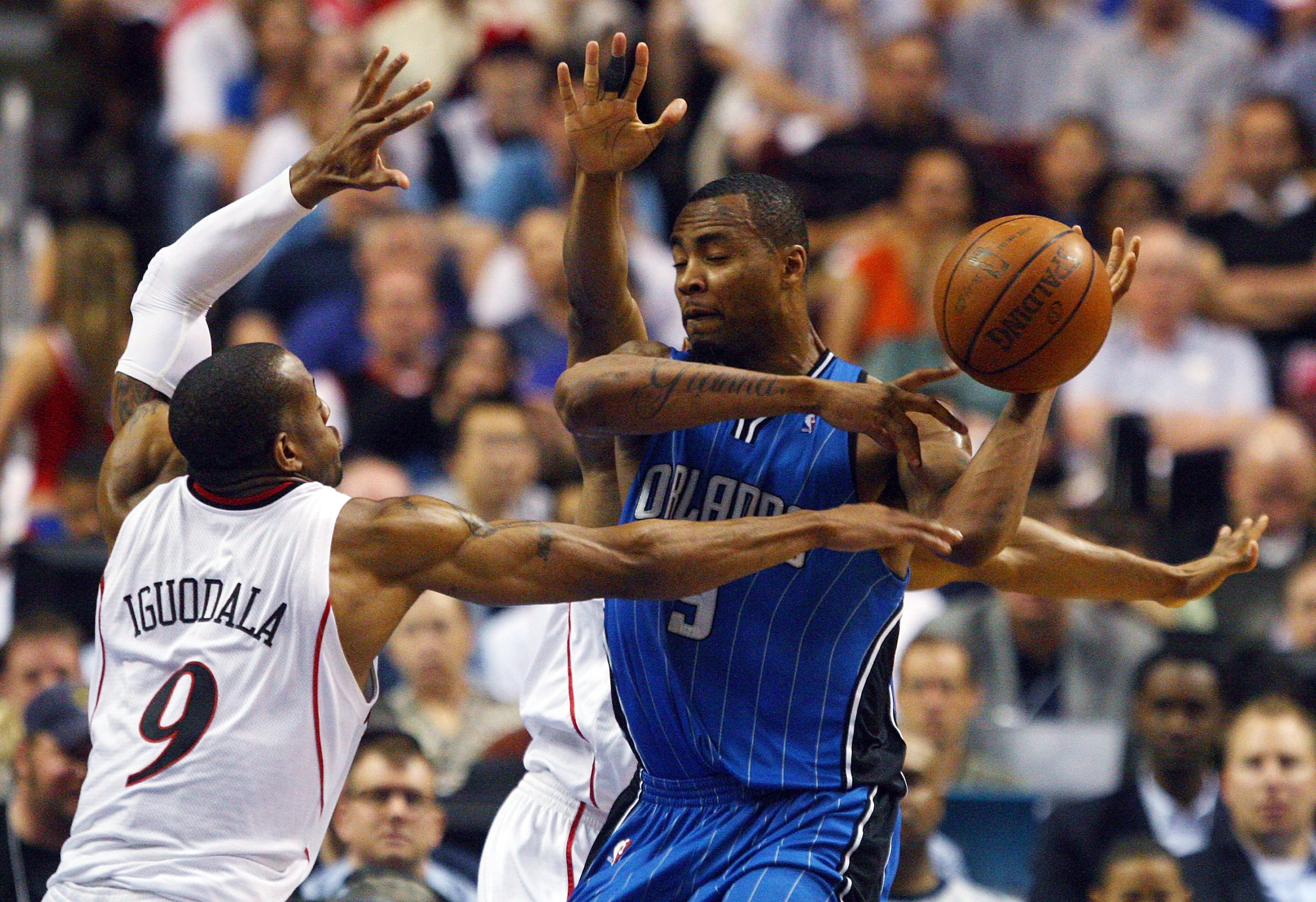 PHILADELPHIA - APRIL 26:  Andre Iguodala #9 of the Philadelphia 76ers defends against Rashard Lewis #9 of the Orlando Magic during Game Four of the Eastern Conference Quarterfinals during the 2009 NBA Playoffs at the Wachovia Center on April 26, 2009 in P