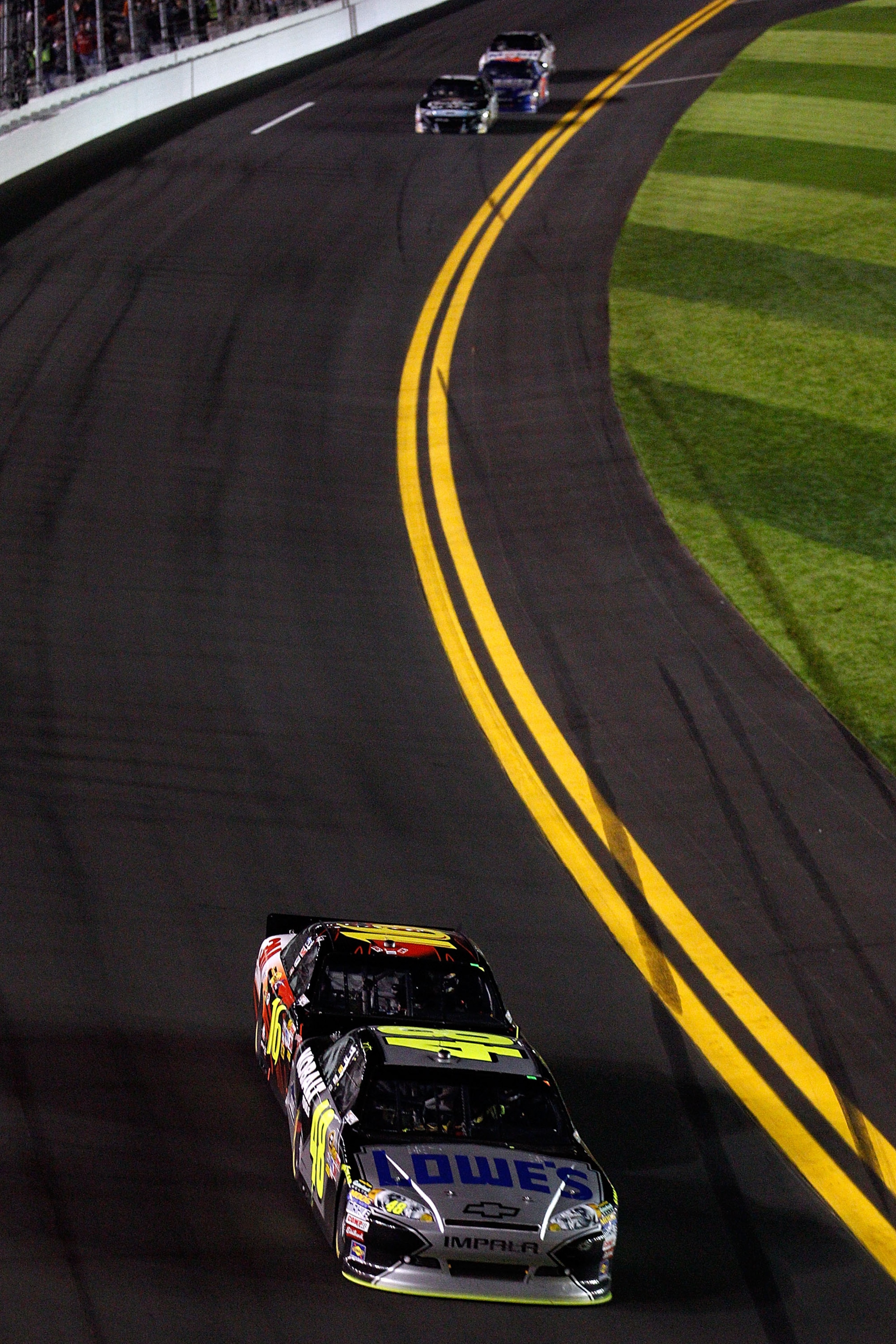 DAYTONA BEACH, FL - FEBRUARY 12:  Jimmie Johnson, driver of the #48 Lowe's Chevrolet,  leads Greg Biffle, driver of the #16 3M Ford, during the NASCAR Budweiser Shootout at Daytona International Speedway on February 12, 2011 in Daytona Beach, Florida.  (P