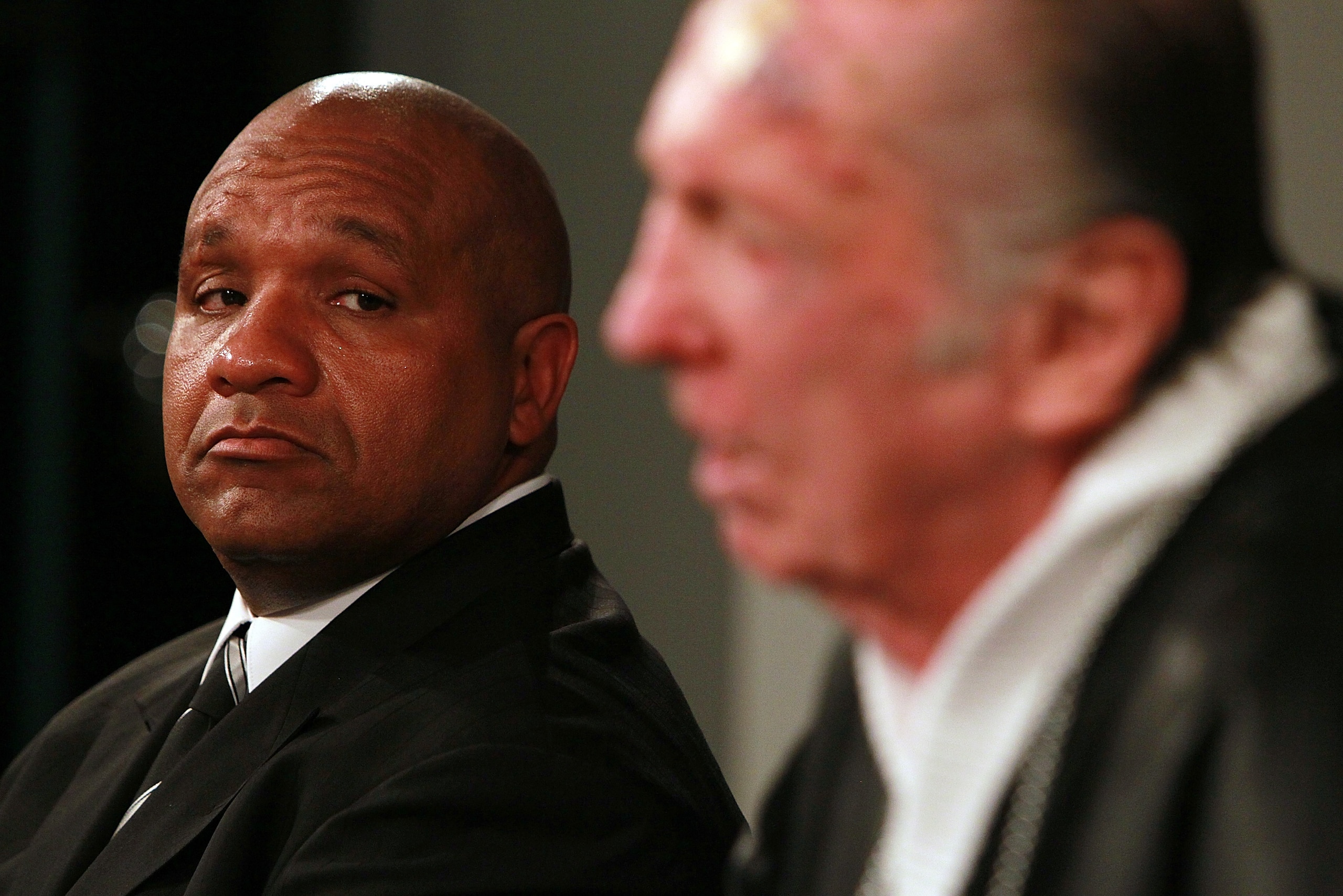 ALAMEDA, CA - JANUARY 18: New Oakland Raiders coach Hue Jackson (L) looks on as Raiders owner Al Davis (R) speaks to reporters after introducing Jackson as the new head coach of the Oakland Raiders on January 18, 2011 in Alameda, California. Hue Jackson ALAMEDA, CA - JANUARY 18: New Oakland Raiders coach Hue Jackson (L) looks on as Raiders owner Al Davis (R) speaks to reporters after introducing Jackson as the new head coach of the Oakland Raiders on January 18, 2011 in Alameda, California. Hue Jackson