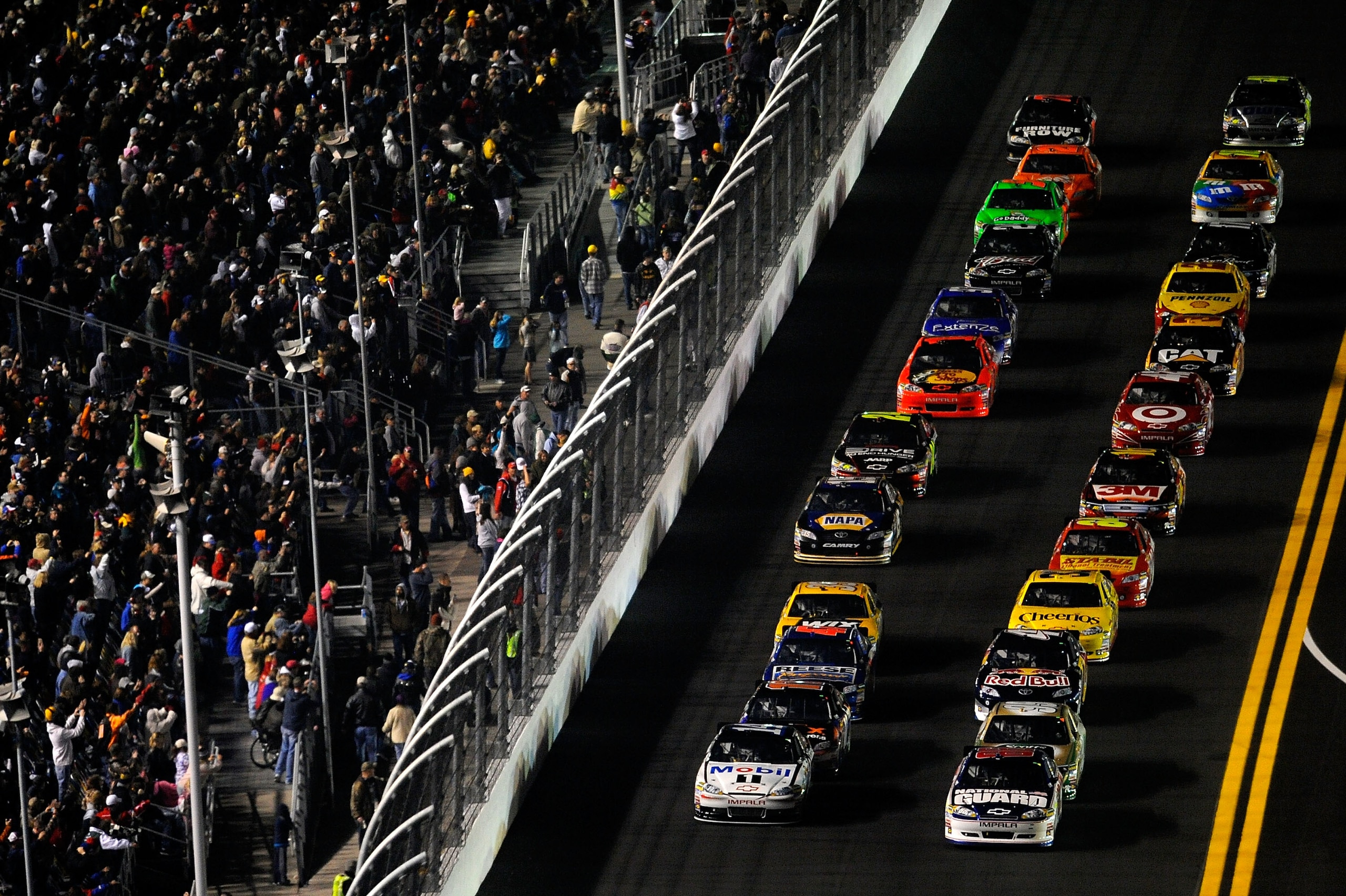 DAYTONA BEACH, FL - FEBRUARY 12:  Dale Earnhardt Jr., driver of the #88 National Guard/AMP Energy Chevrolet, leads the field at the start of the NASCAR Budweiser Shootout at Daytona International Speedway on February 12, 2011 in Daytona Beach, Florida.  (