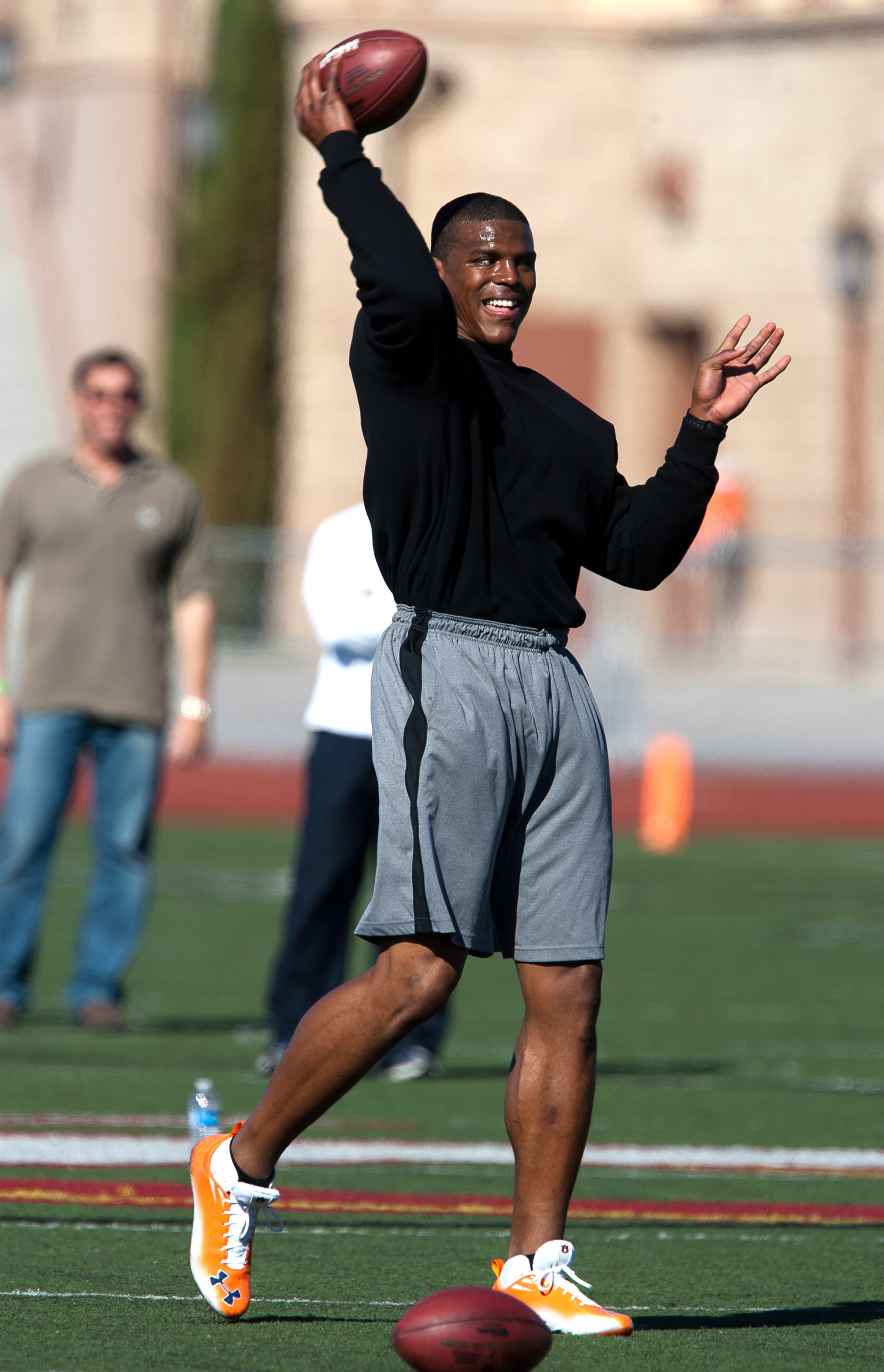 SAN DIEGO, CA - FEBRUARY 10: 2010 Heisman Trophy winning quarterback Cam Newton of Auburn throws the ball during his workout routine for the media at Cathedral High School's sports stadium on February 10, 2011 in San Diego, California. (Photo by Kent Horn