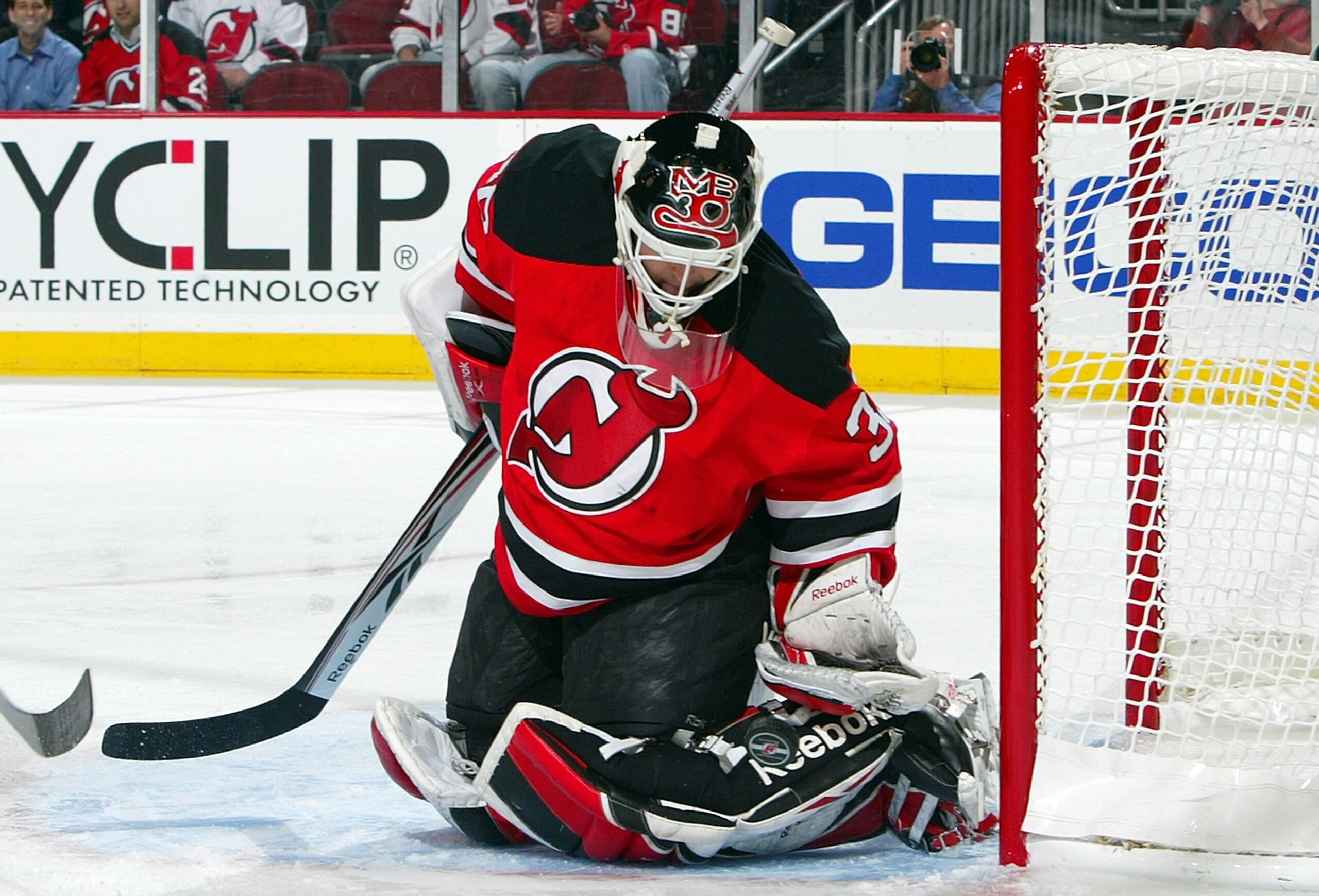 NEWARK, NJ - APRIL 23:  Martin Brodeur #30 of the New Jersey Devils defends his net against the Carolina Hurricanes during Game Five of the Eastern Conference Quarterfinal Round of the 2009 NHL Stanley Cup Playoffs on April 23, 2009 at the Prudential Cent